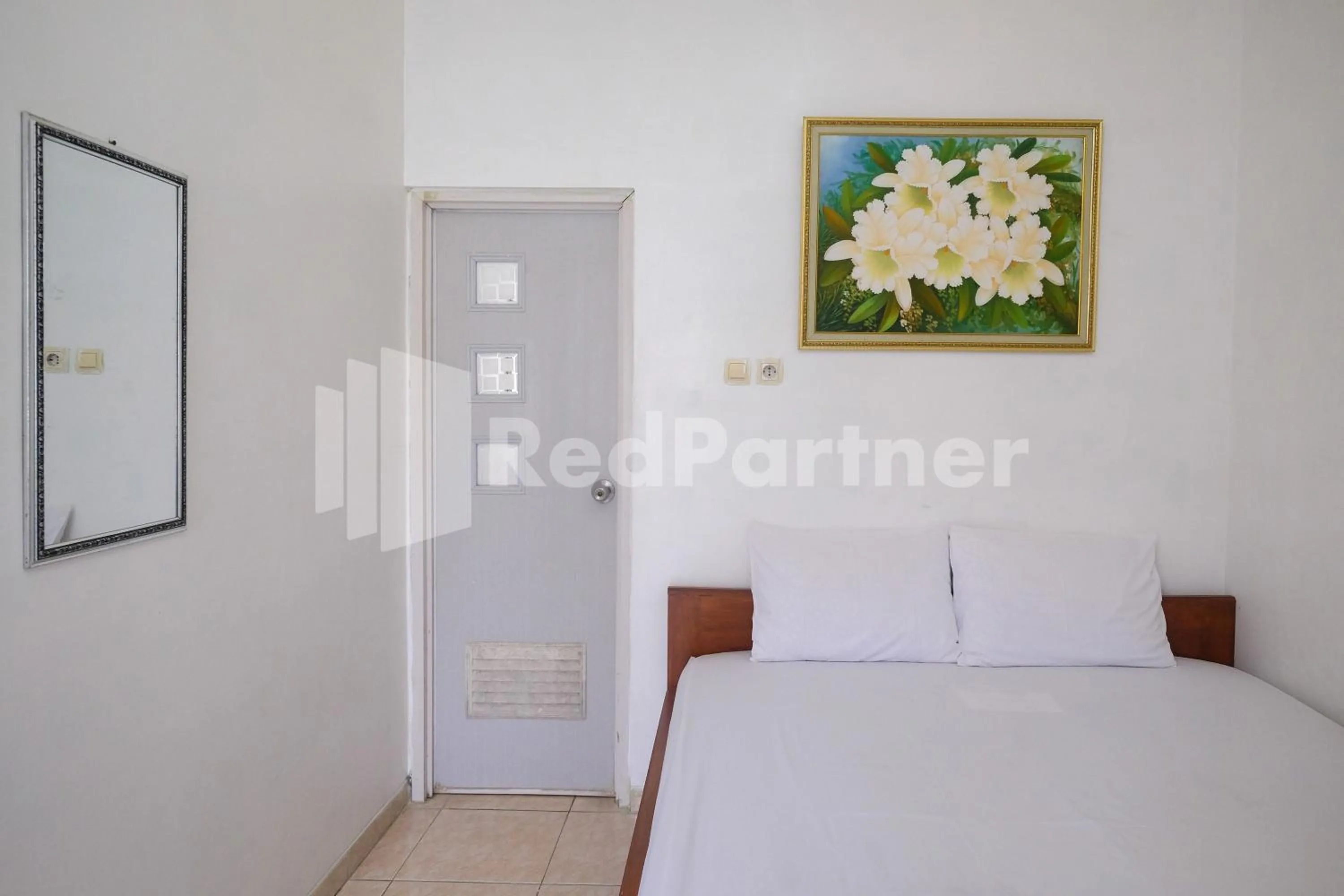 Bed in Wisma Giri Mulyo B near Grojogan Sewu Mitra RedDoorz