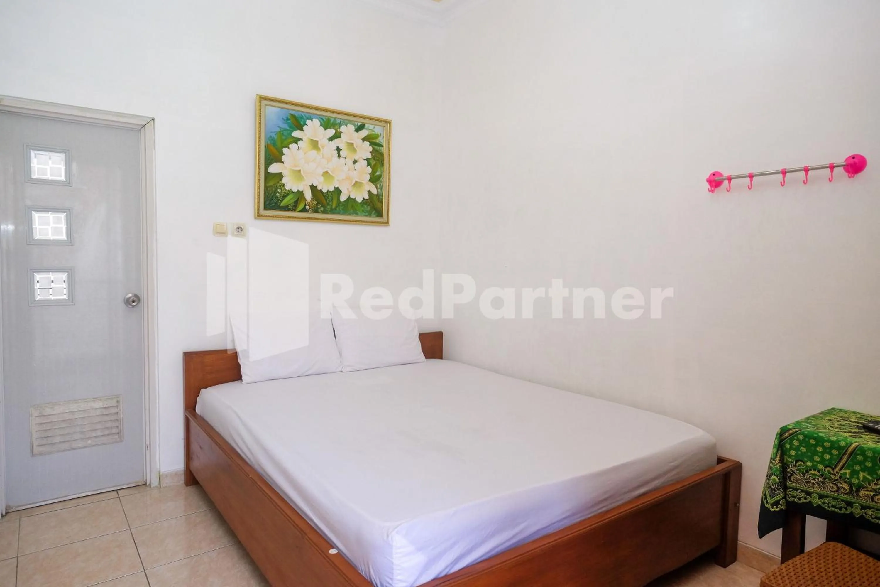 Bed in Wisma Giri Mulyo B near Grojogan Sewu Mitra RedDoorz