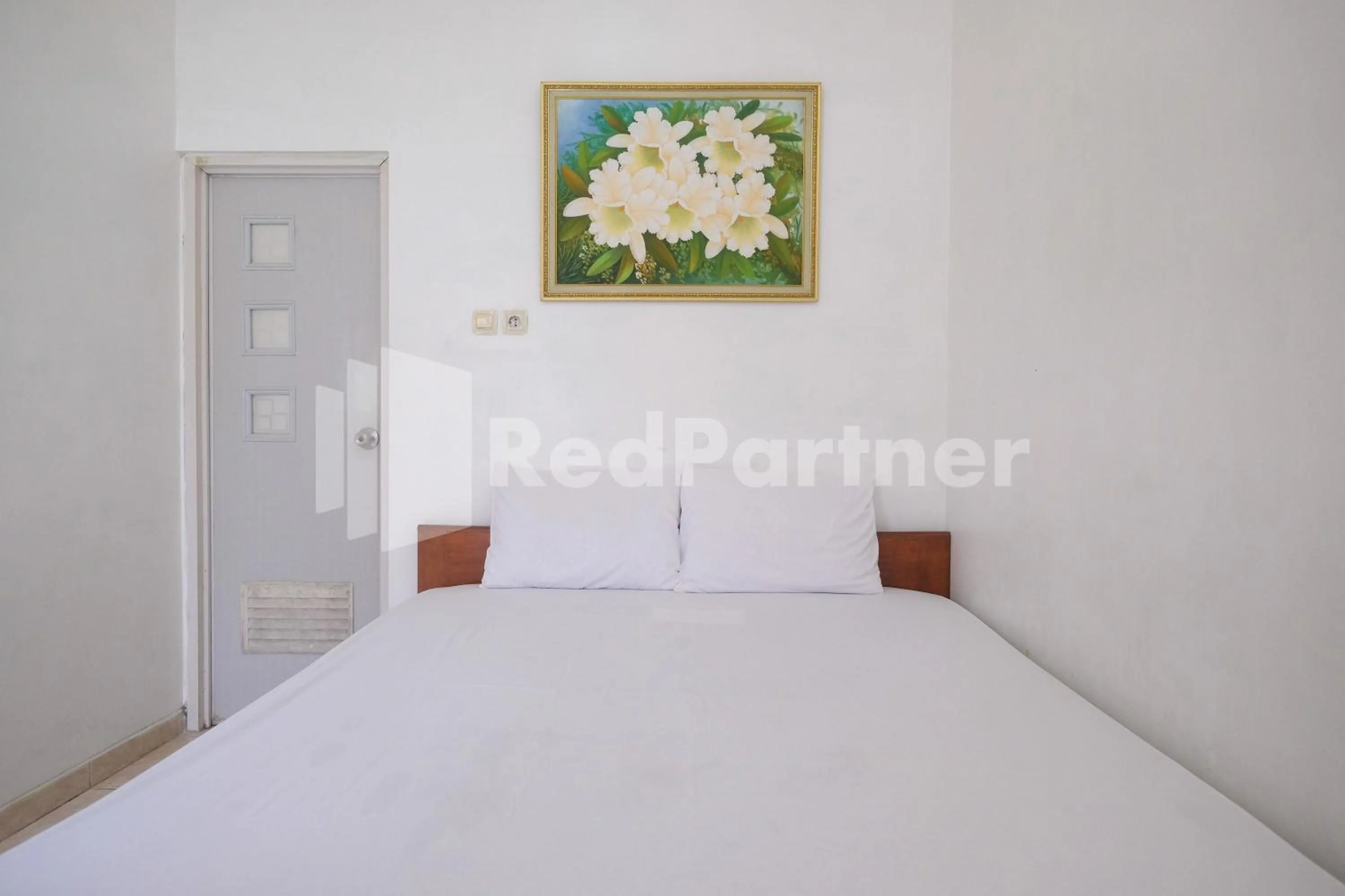 Bed in Wisma Giri Mulyo B near Grojogan Sewu Mitra RedDoorz