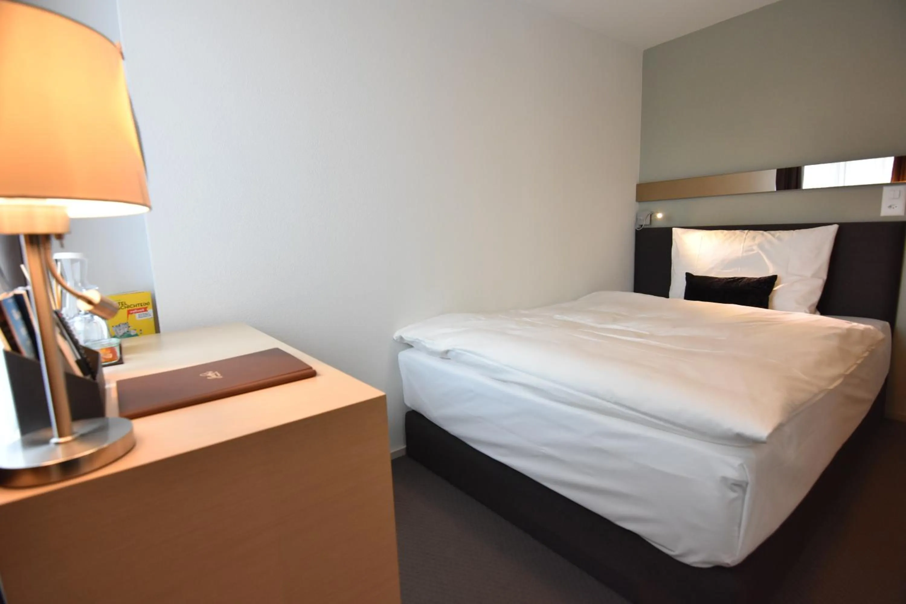 Bed in JUCKERs Boutique-Hotel