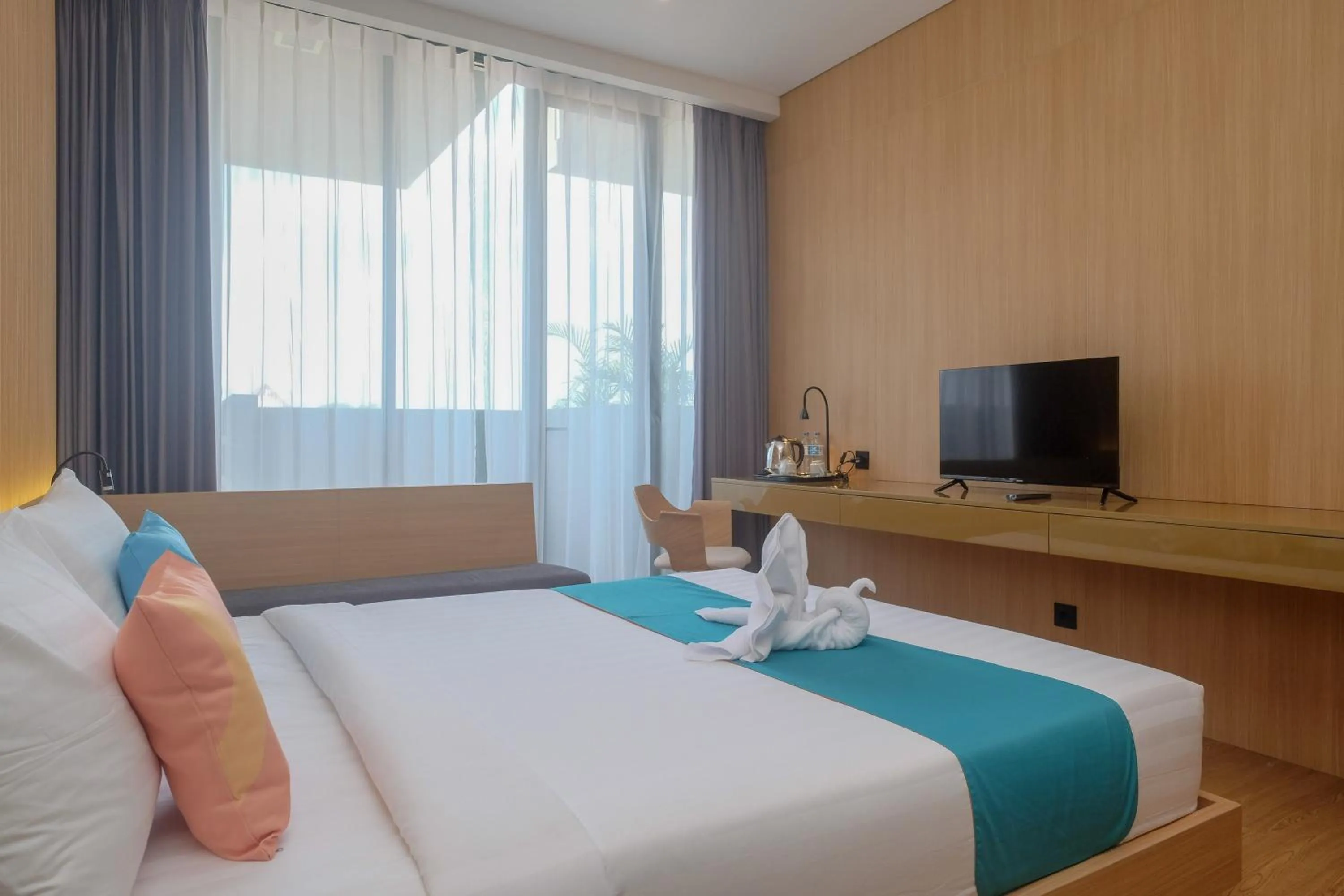 Bed in Sans Hotel RG Living Jogja by RedDoorz