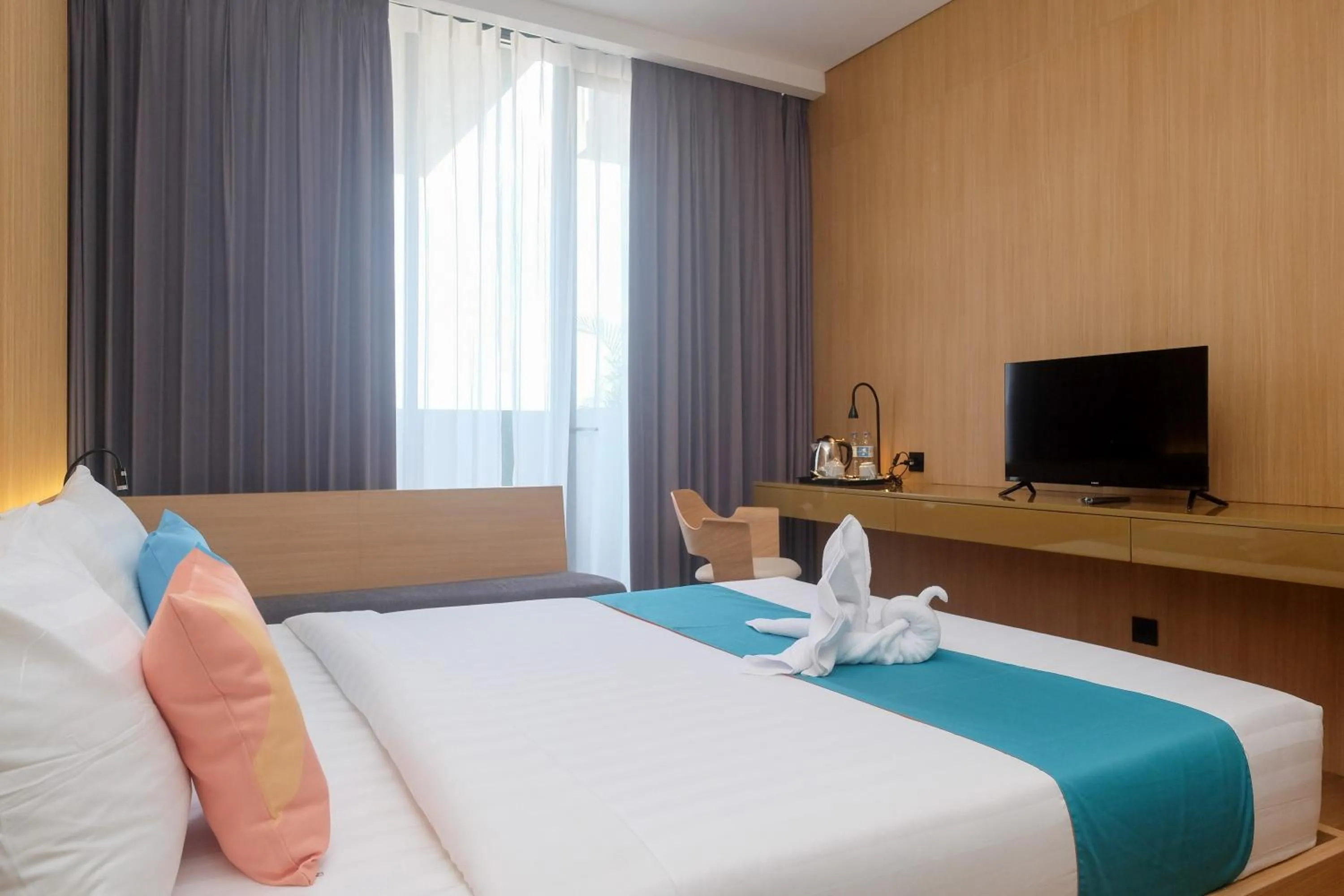 Bed in Sans Hotel RG Living Jogja by RedDoorz