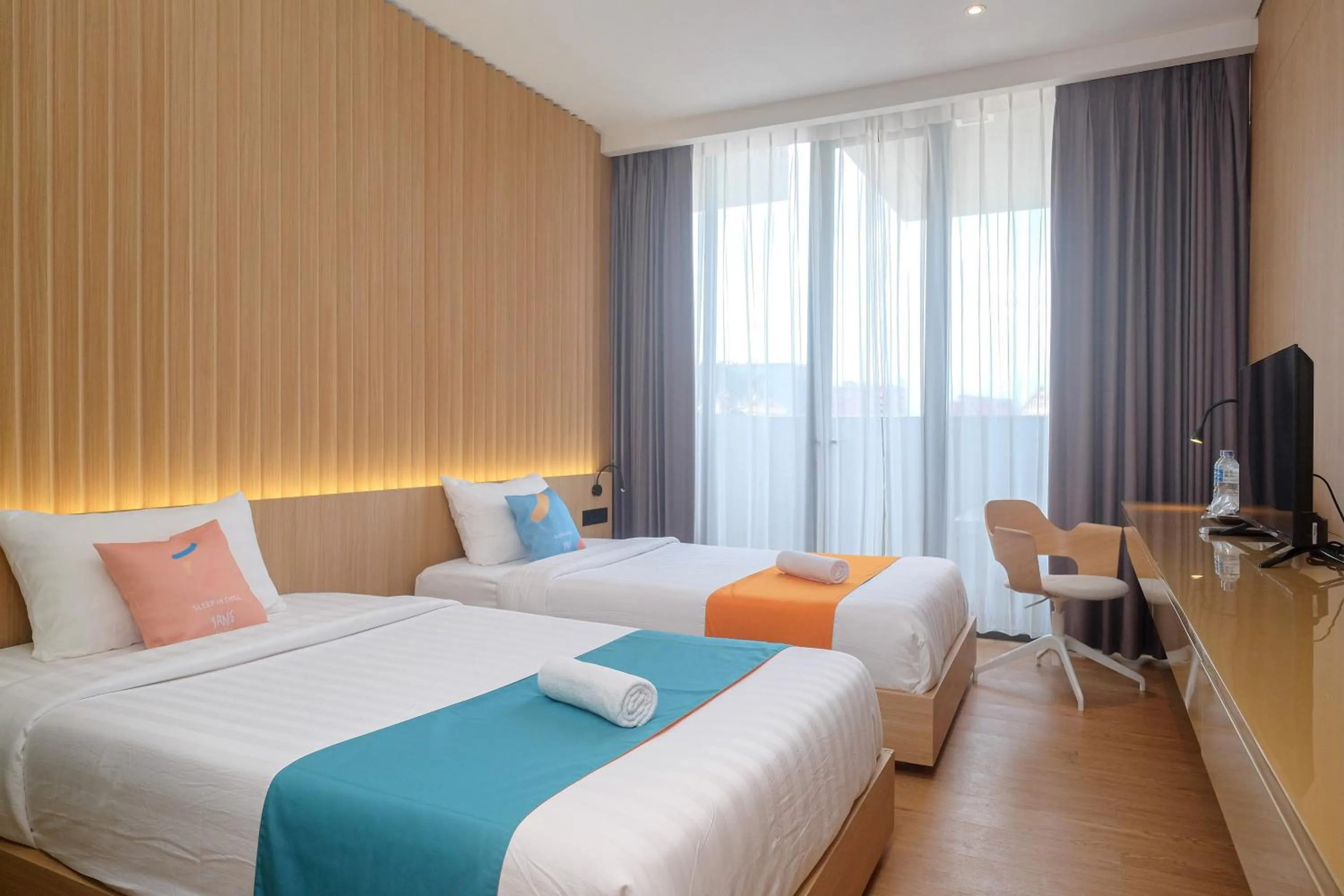Bed in Sans Hotel RG Living Jogja by RedDoorz