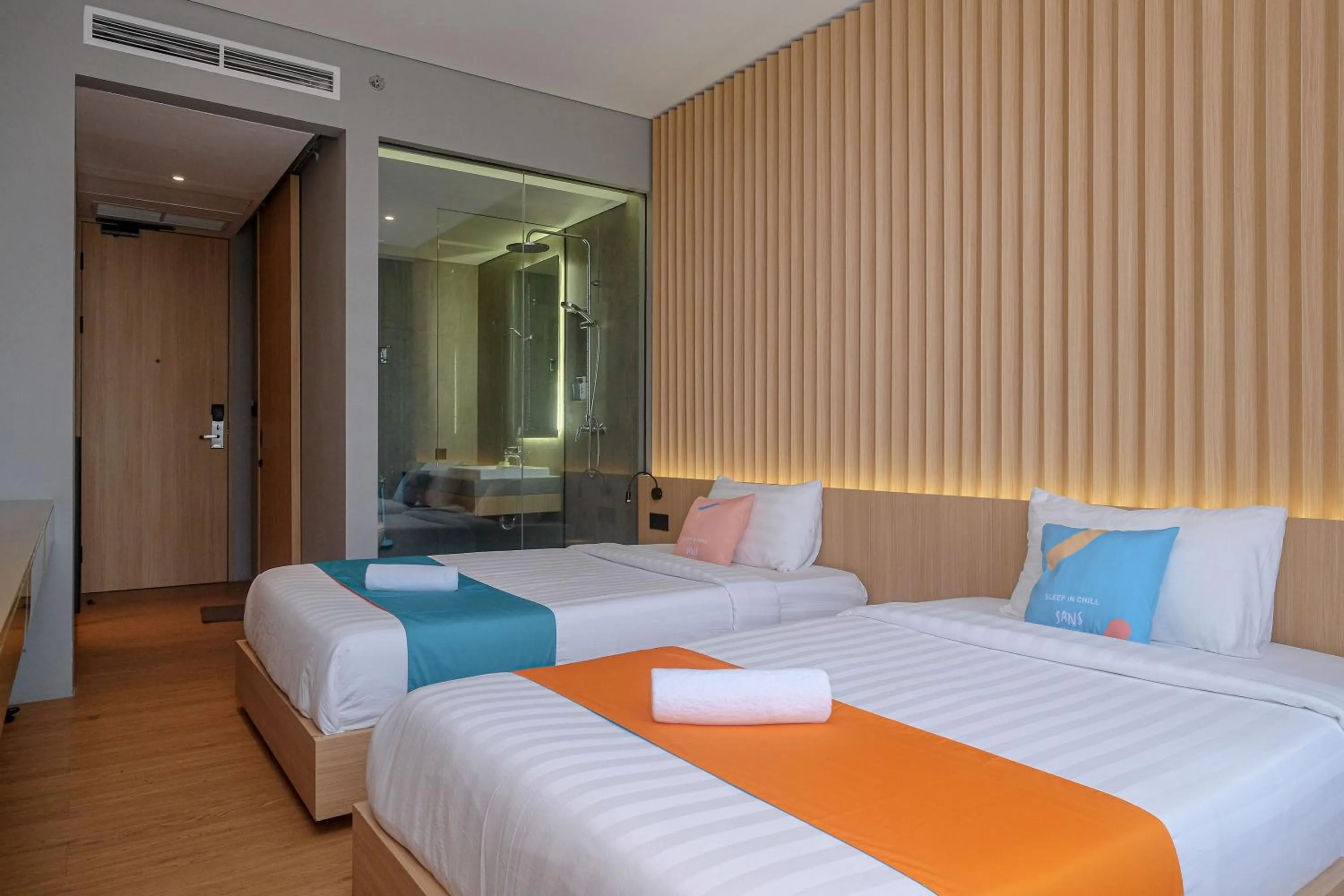 Bed in Sans Hotel RG Living Jogja by RedDoorz