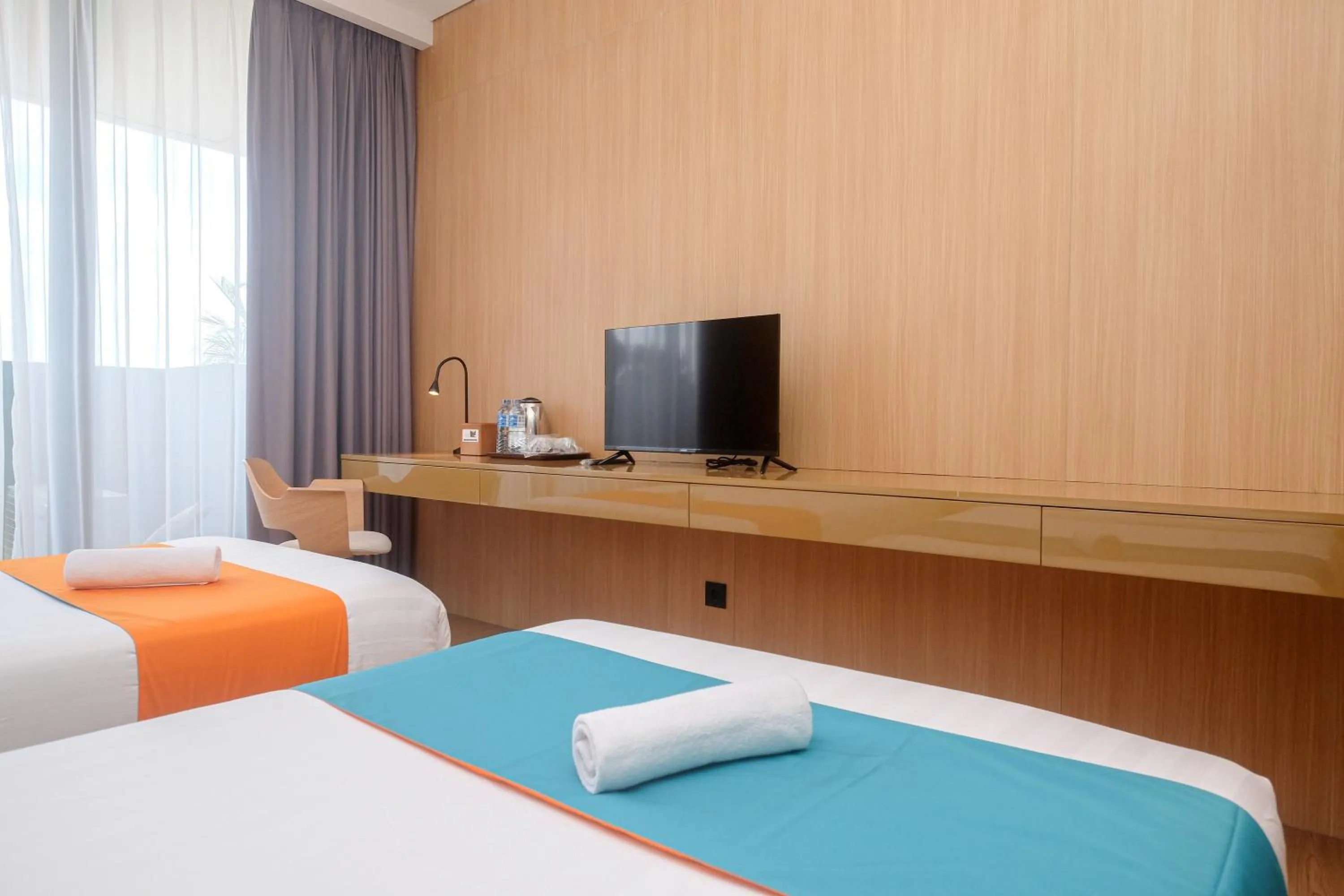 Bed in Sans Hotel RG Living Jogja by RedDoorz