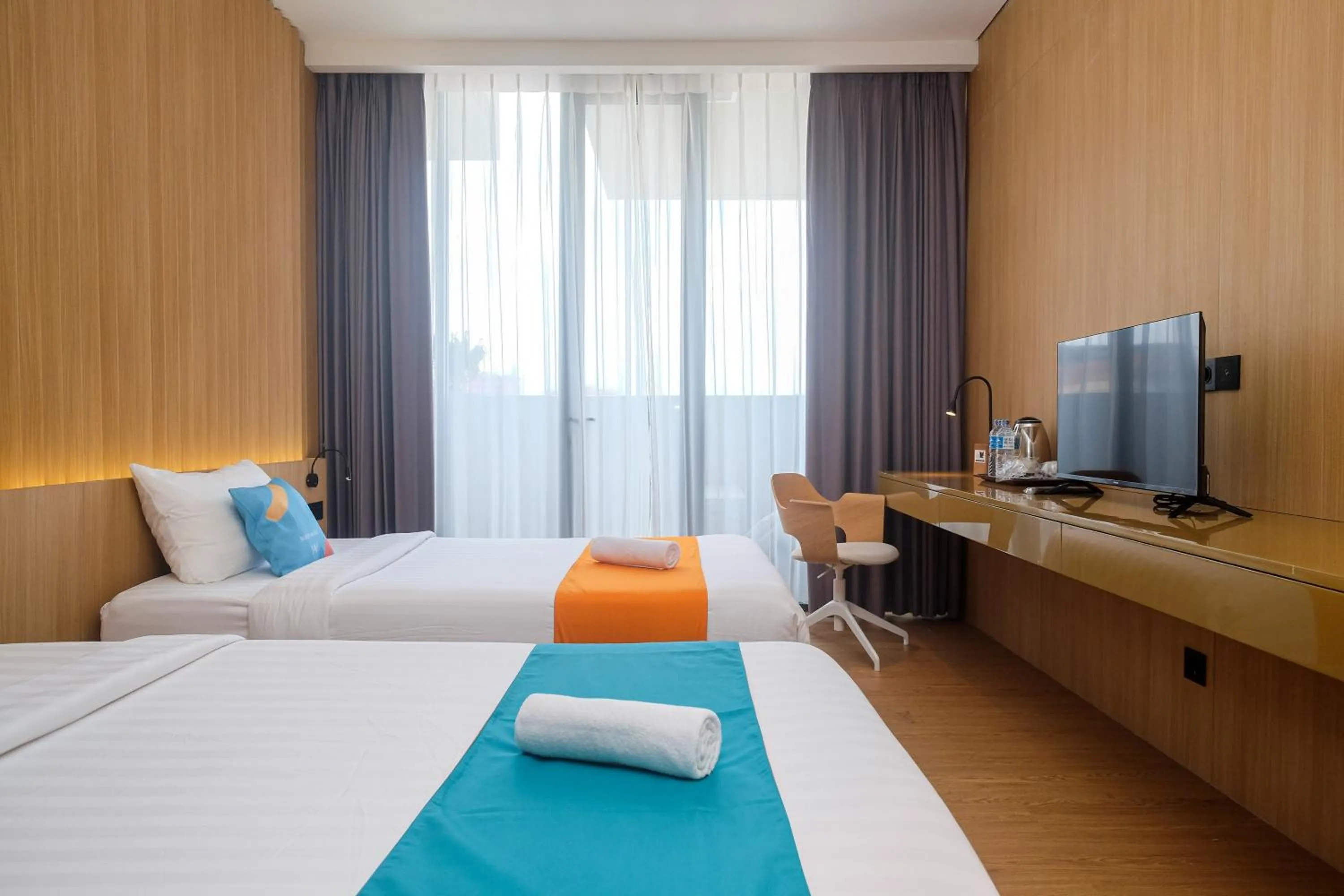 Bed in Sans Hotel RG Living Jogja by RedDoorz