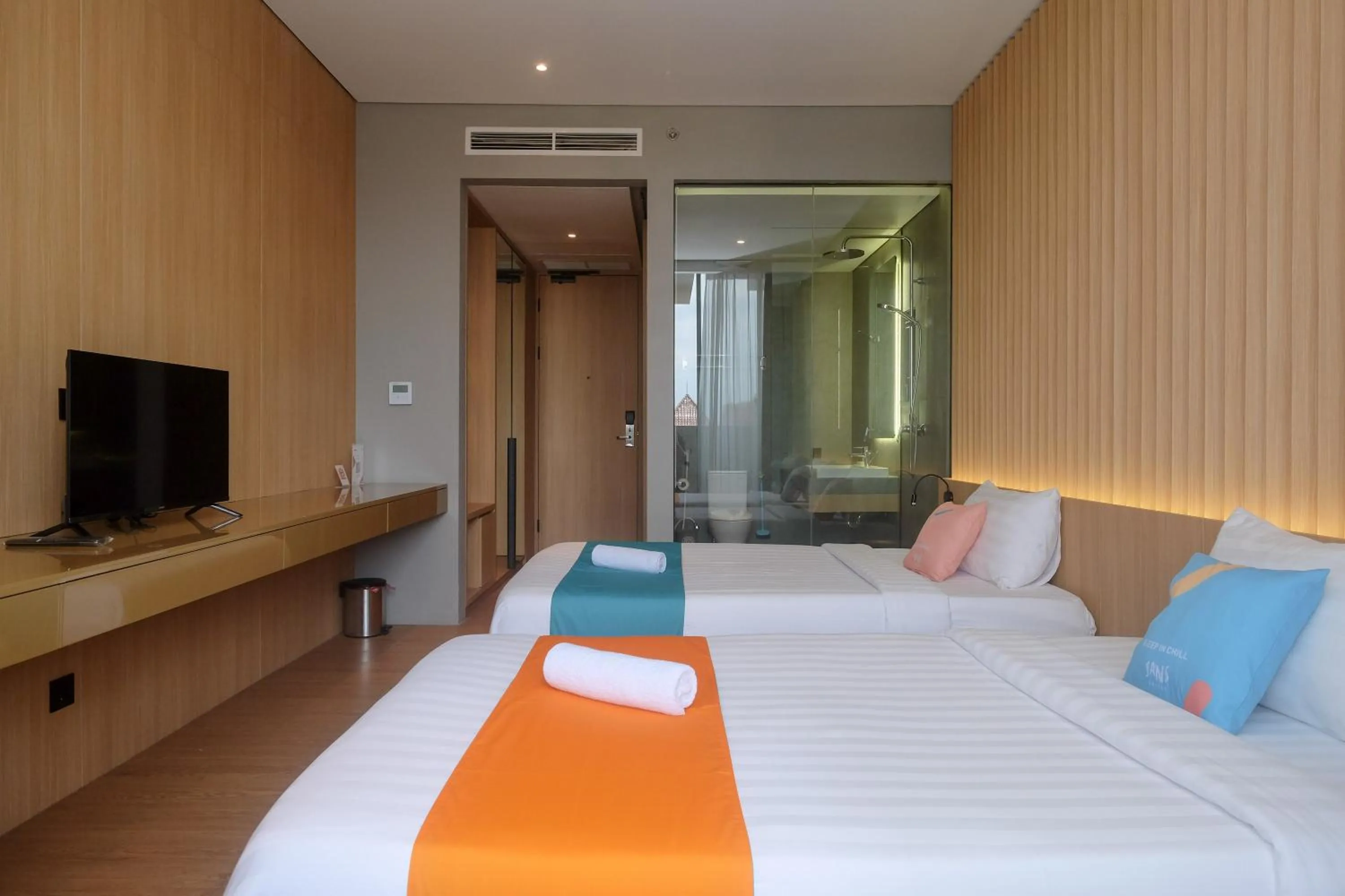 Bed in Sans Hotel RG Living Jogja by RedDoorz