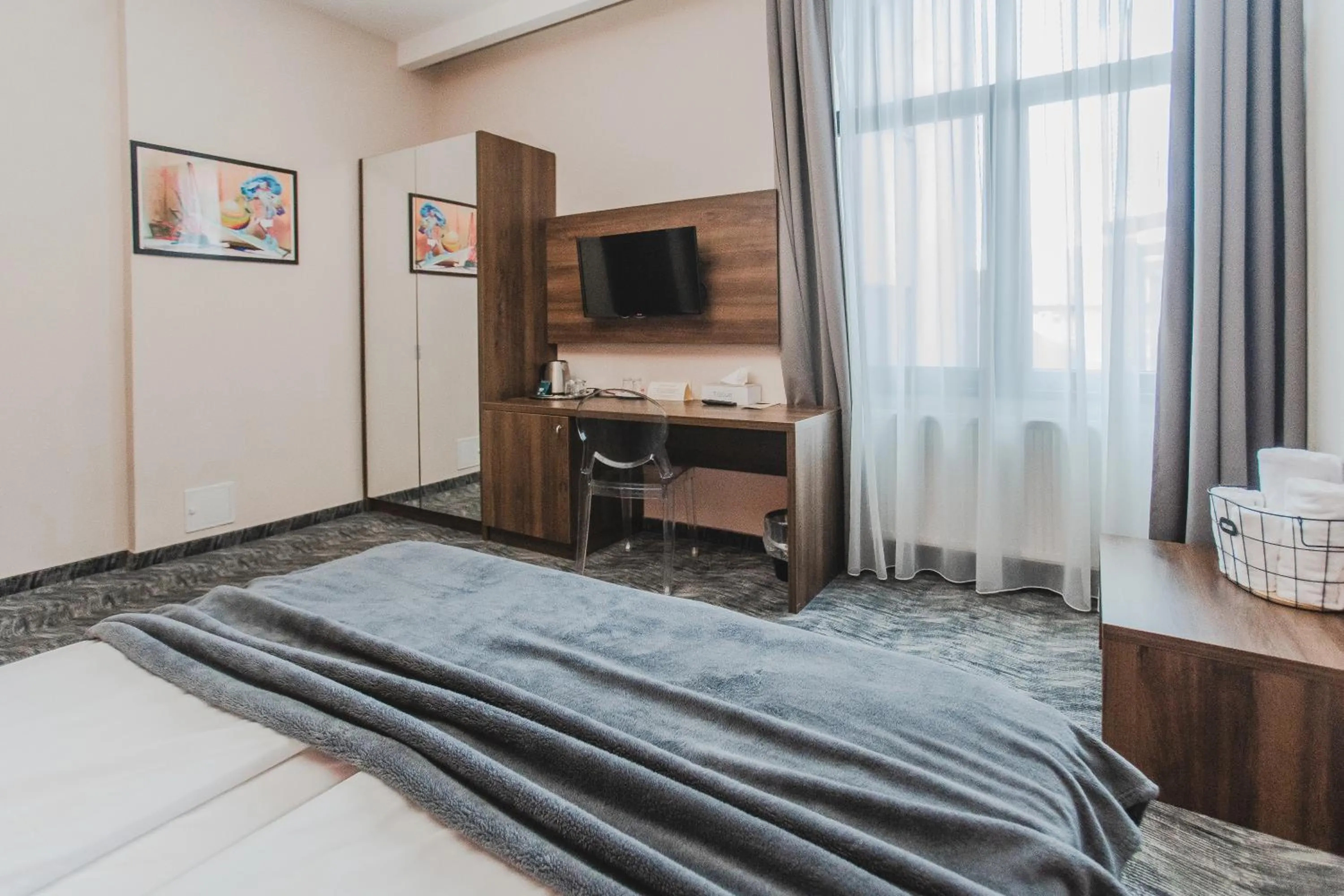 Bed in Caro Boutique Hotel