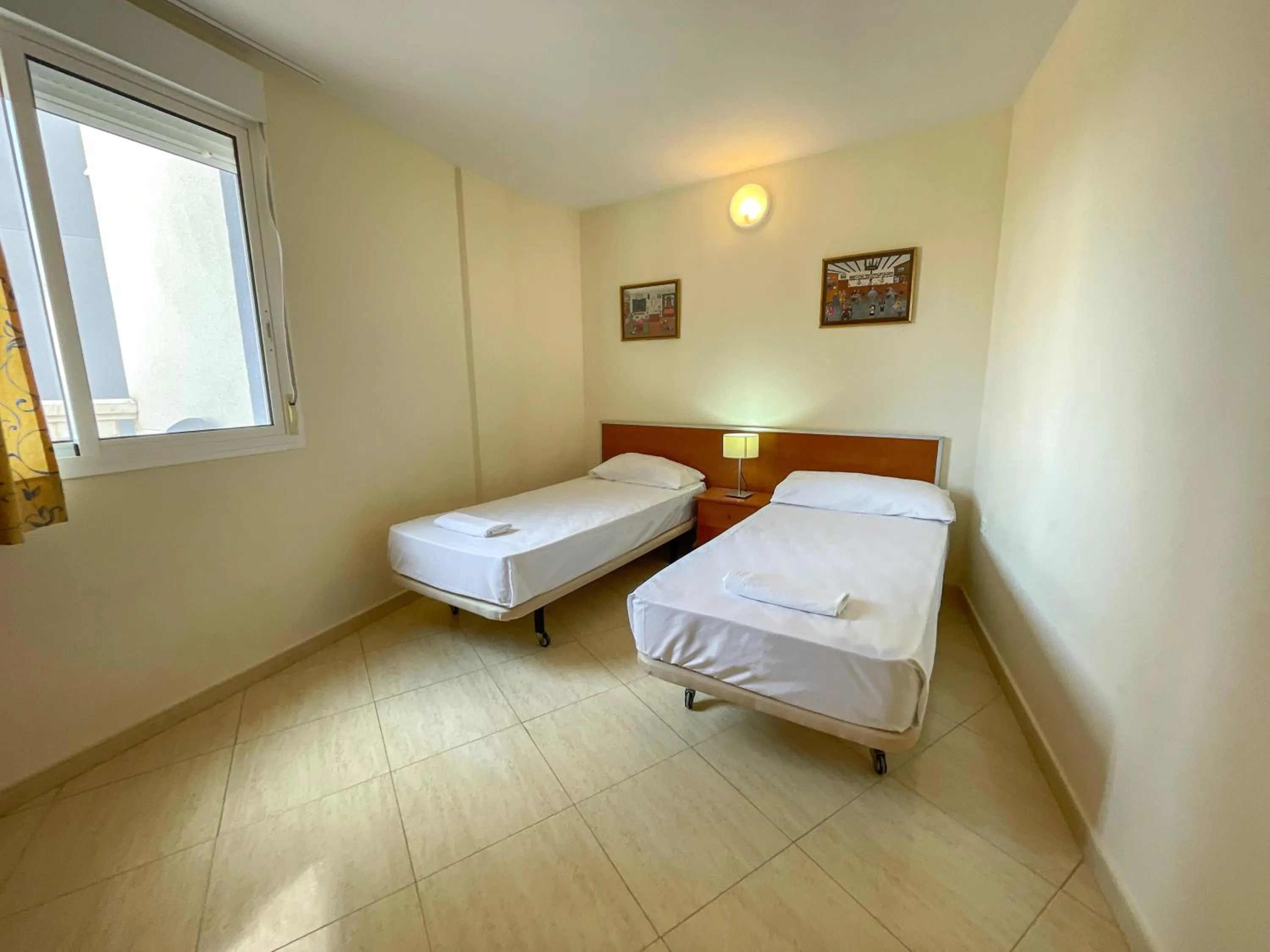 Bed in Apartamentos Marcomar 3000