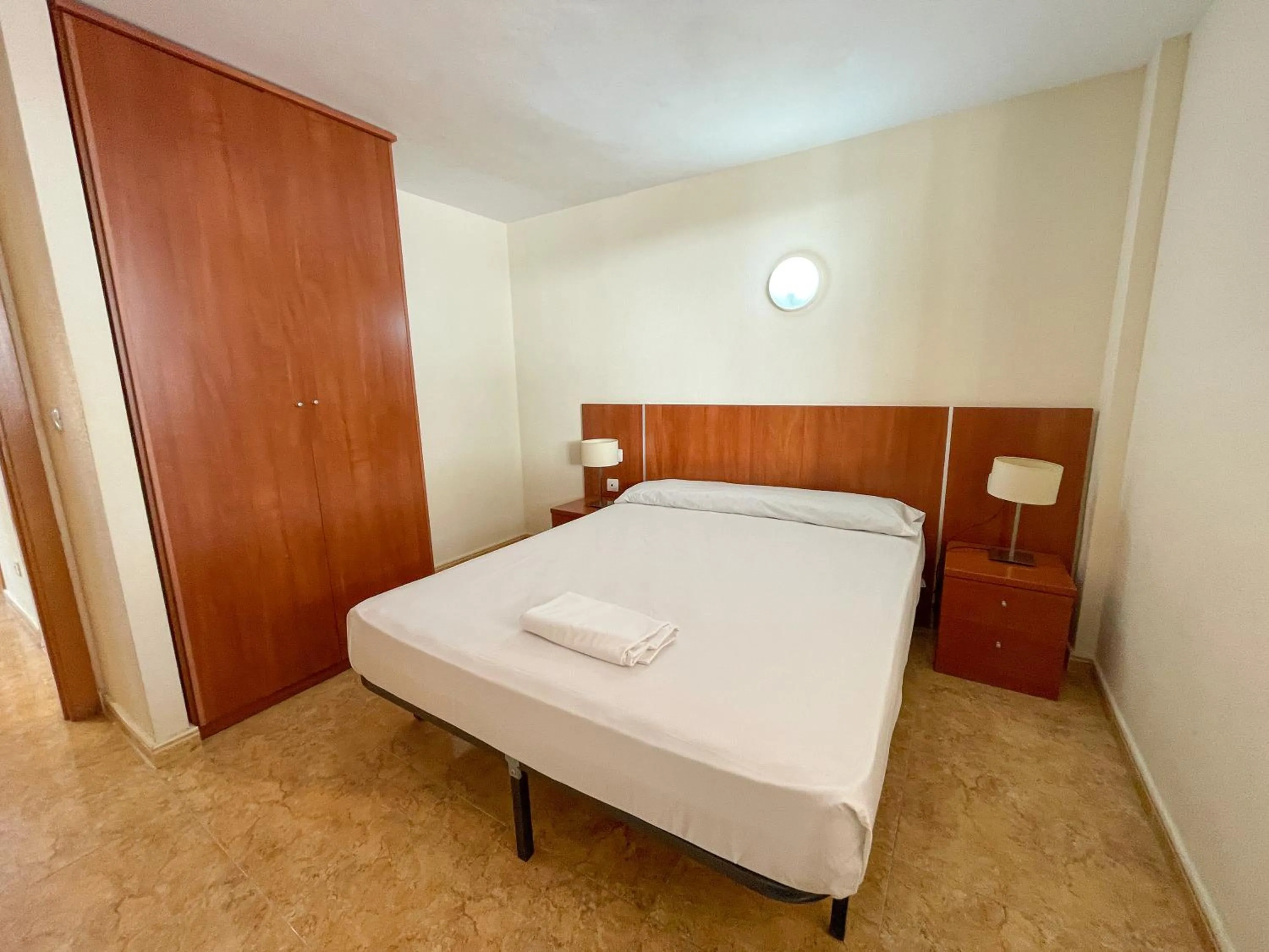 Bed in Apartamentos Marcomar 3000