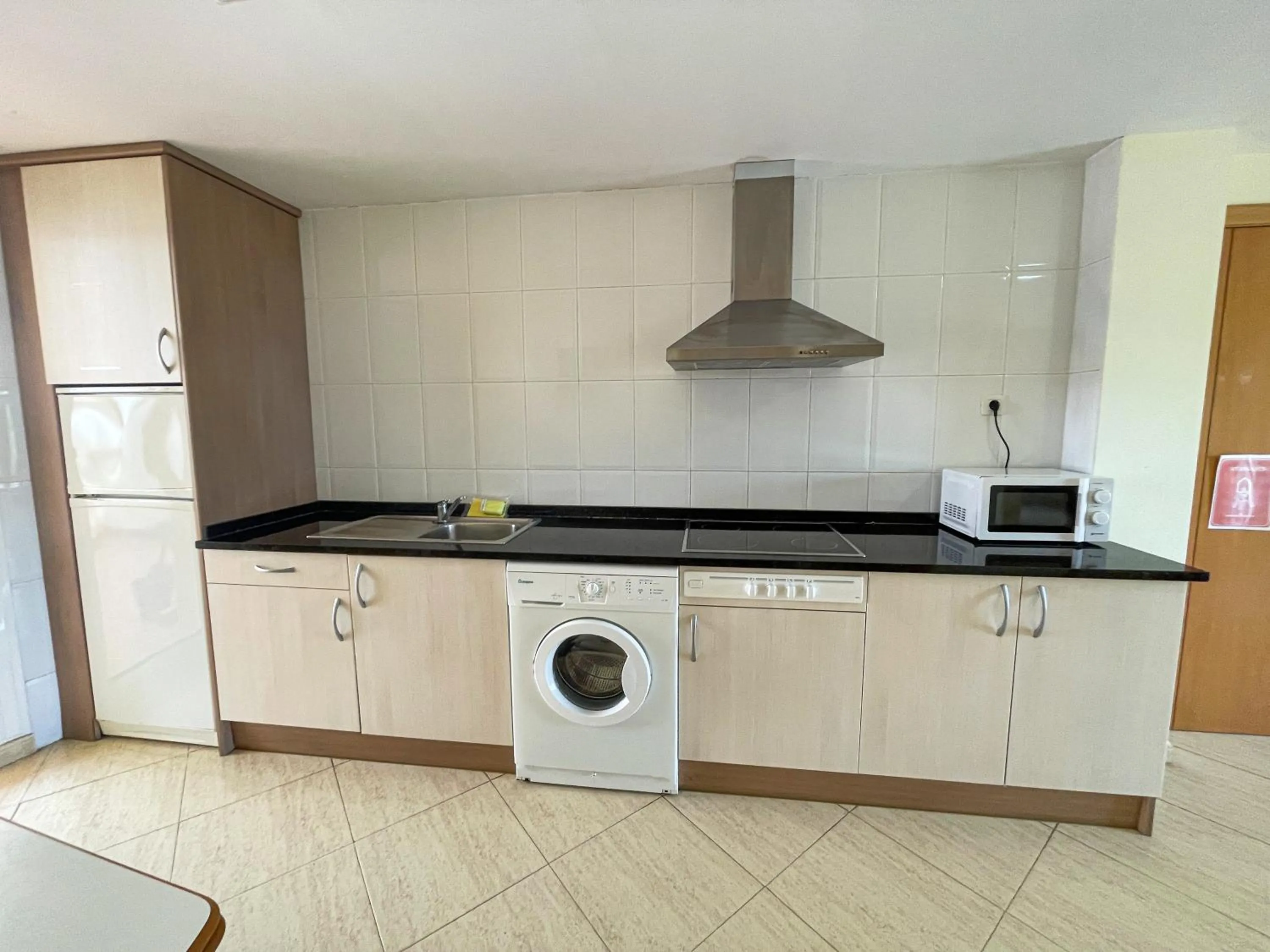 Kitchen or kitchenette in Apartamentos Marcomar 3000