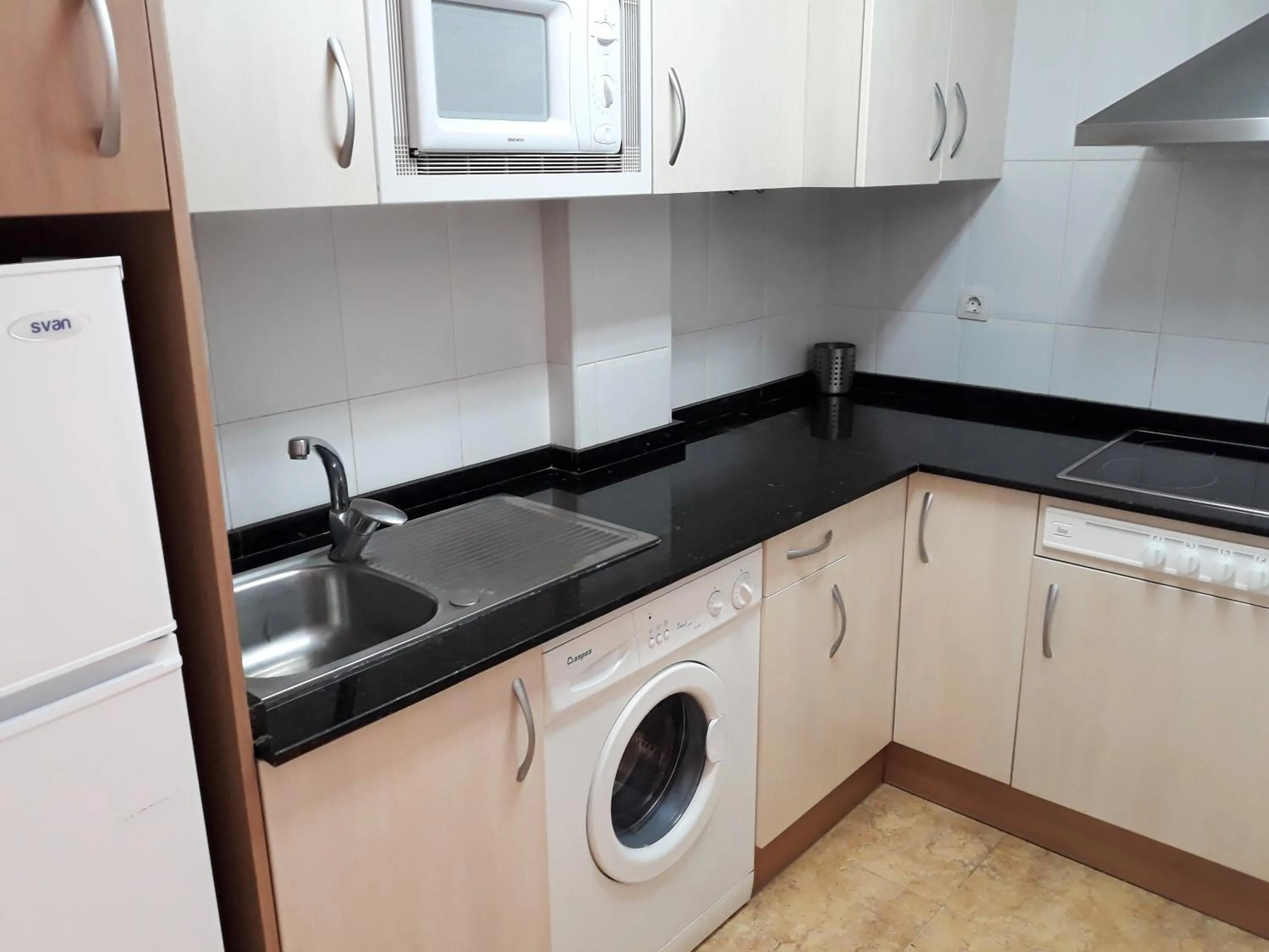 Kitchen or kitchenette in Apartamentos Marcomar 3000