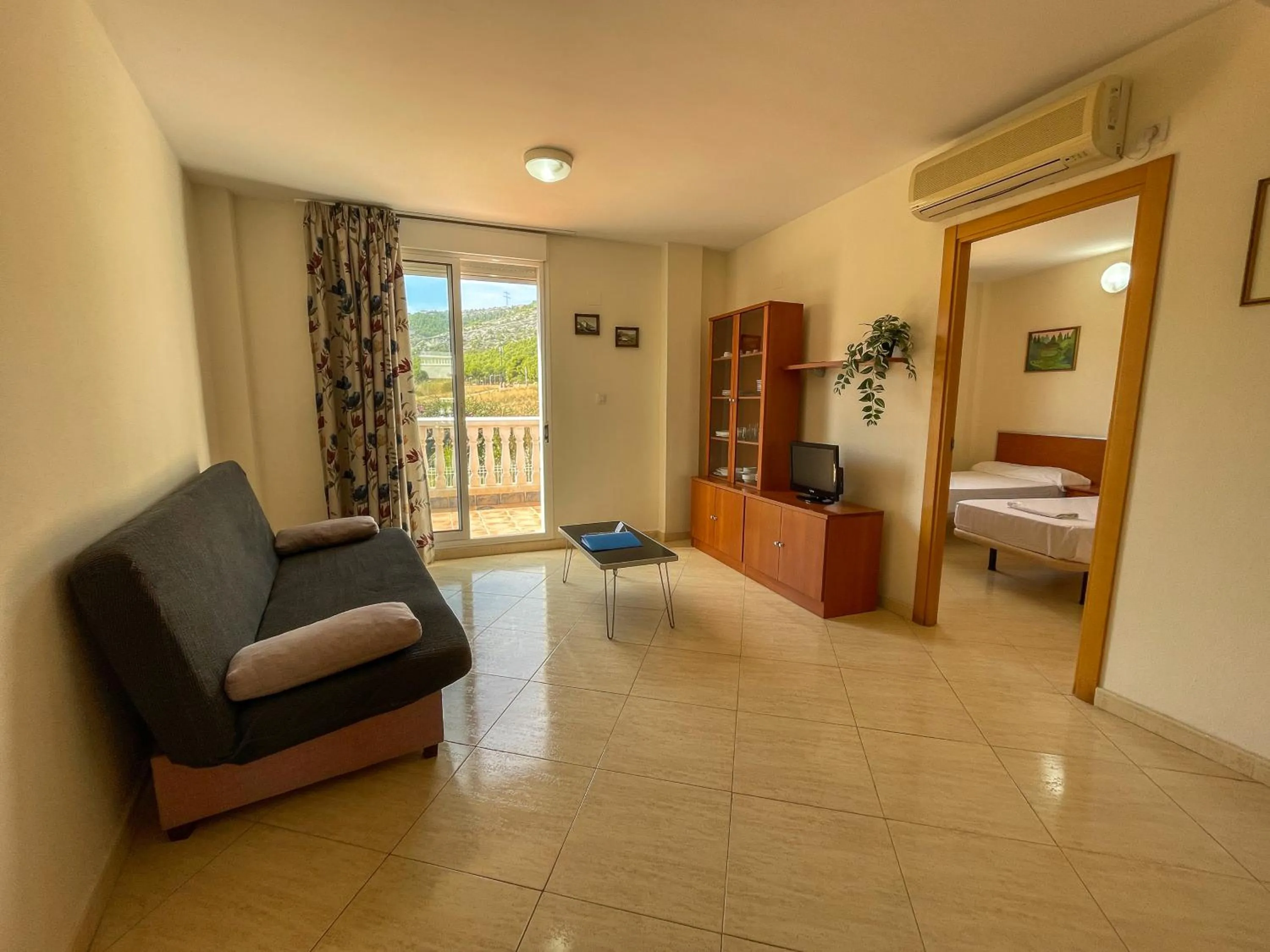 TV and multimedia, Bed in Apartamentos Marcomar 3000