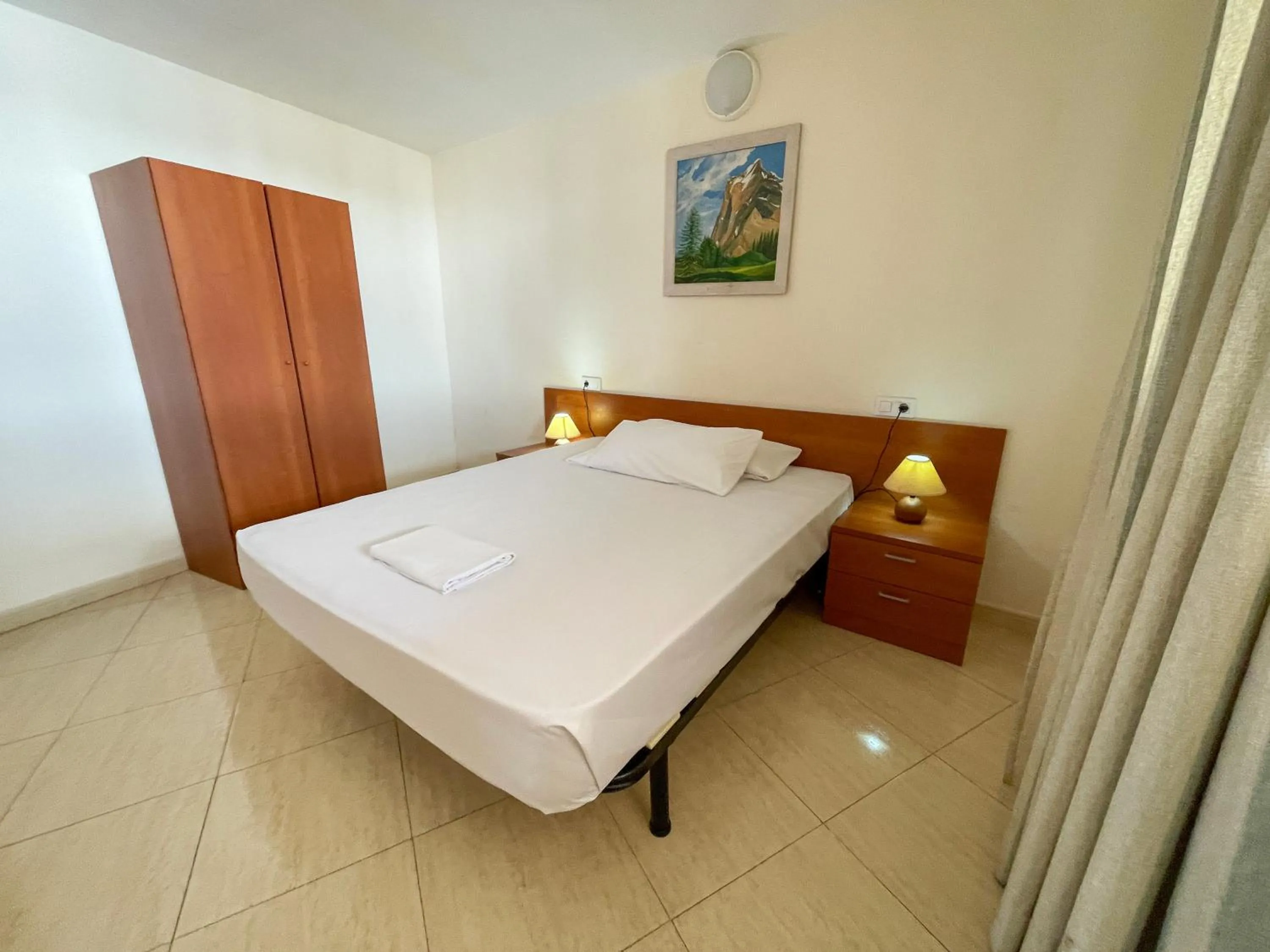 Bed in Apartamentos Marcomar 3000