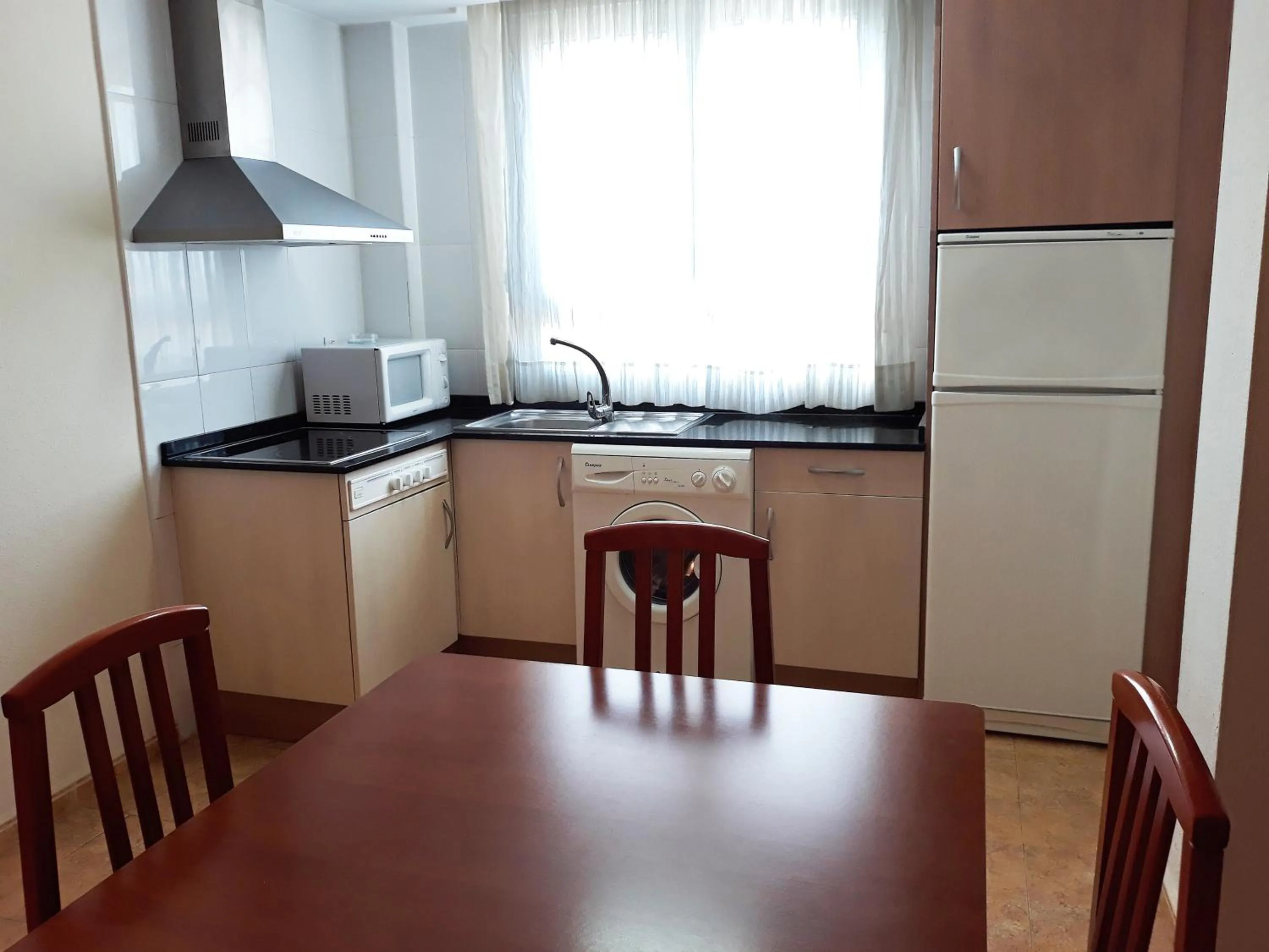 Kitchen or kitchenette in Apartamentos Marcomar 3000