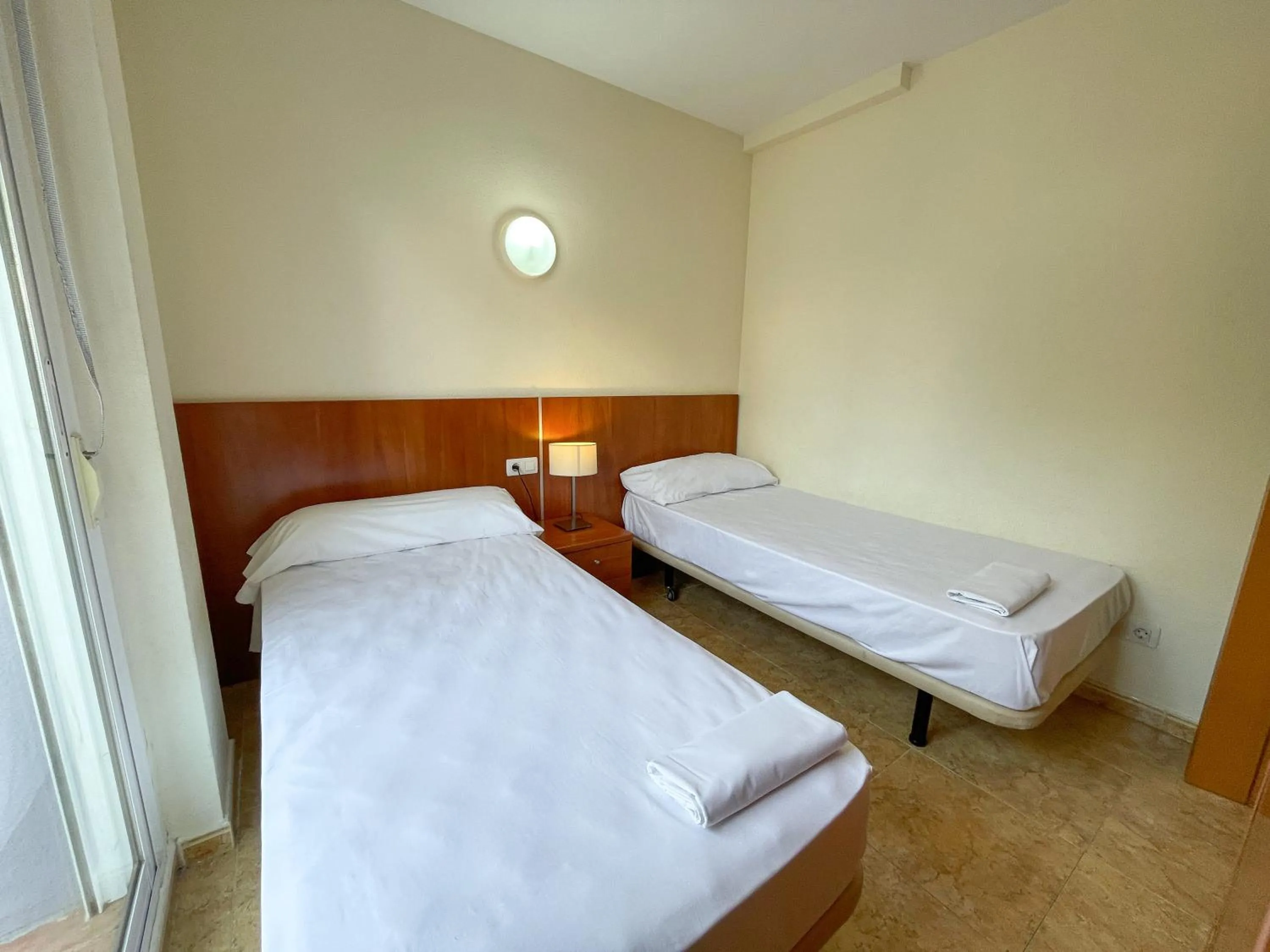 Bed in Apartamentos Marcomar 3000