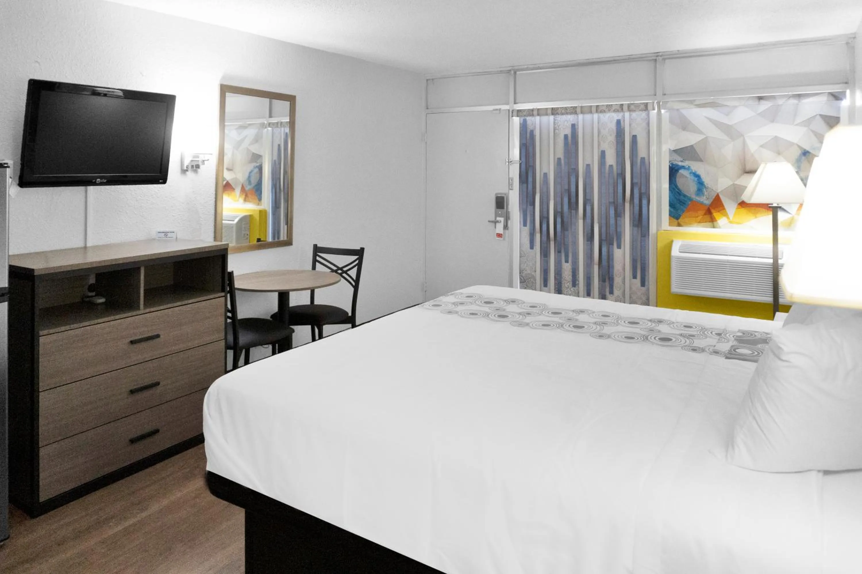 Bed in Hometown Inn + Kitchen