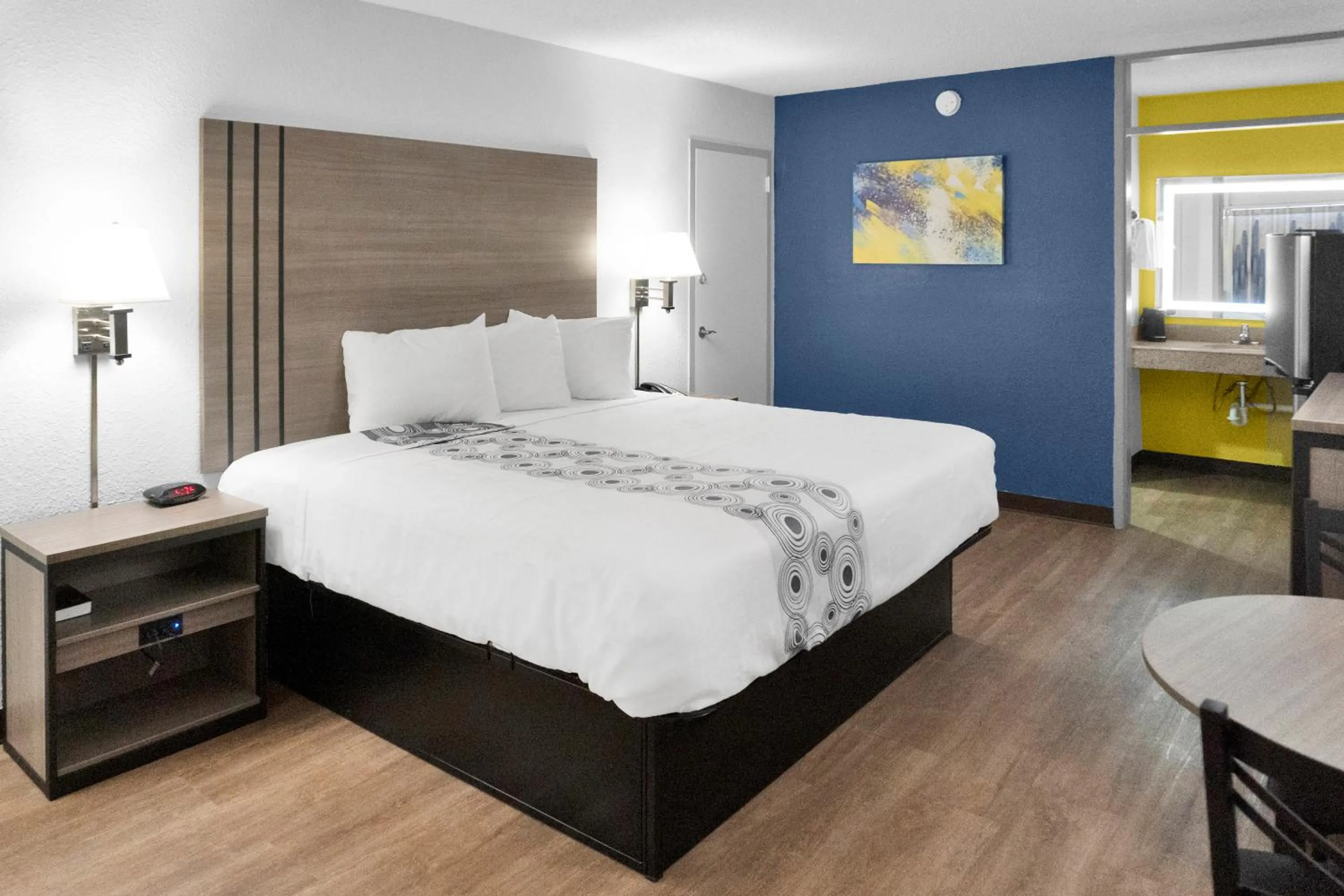 Bed in Hometown Inn + Kitchen