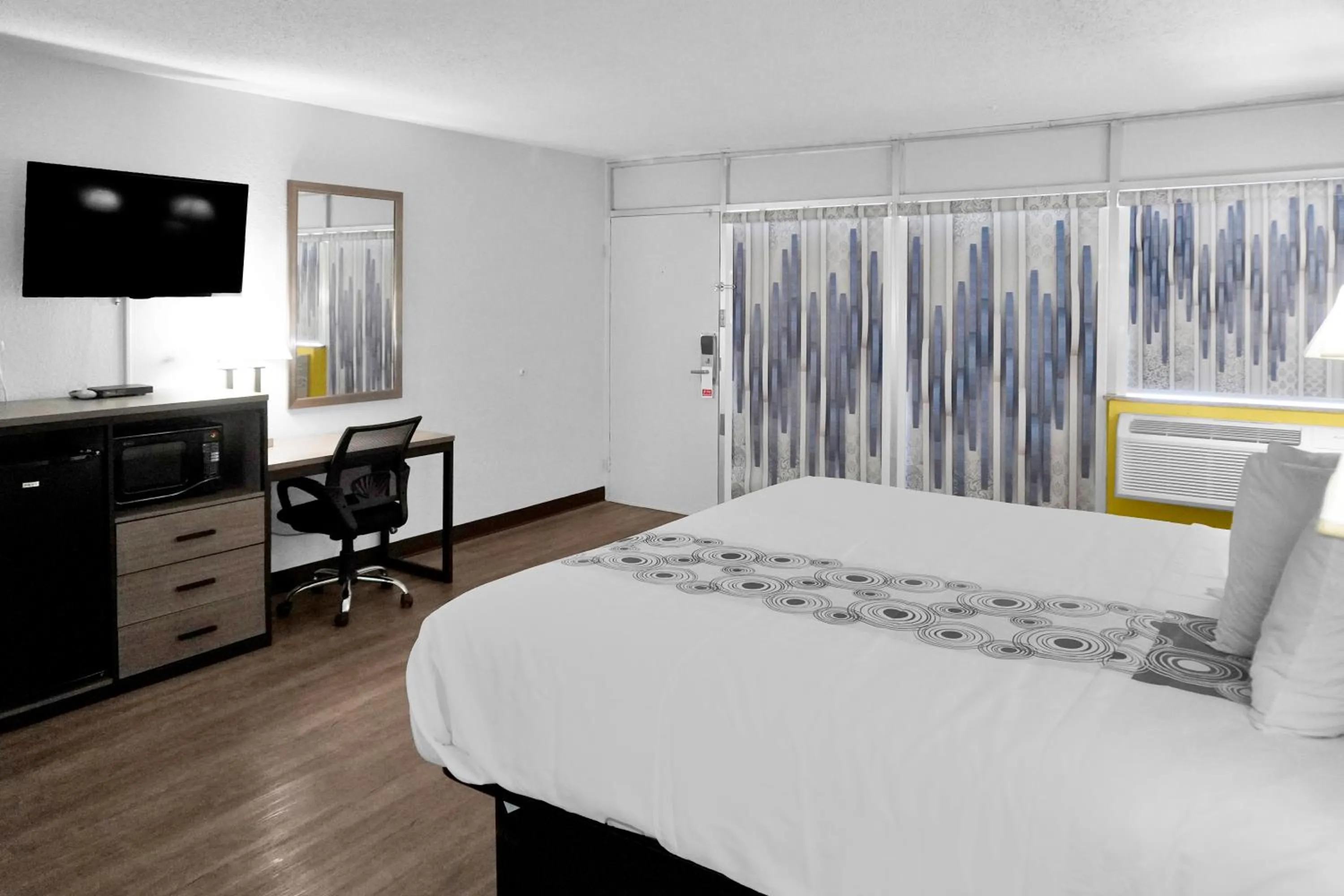 Bed in Hometown Inn + Kitchen