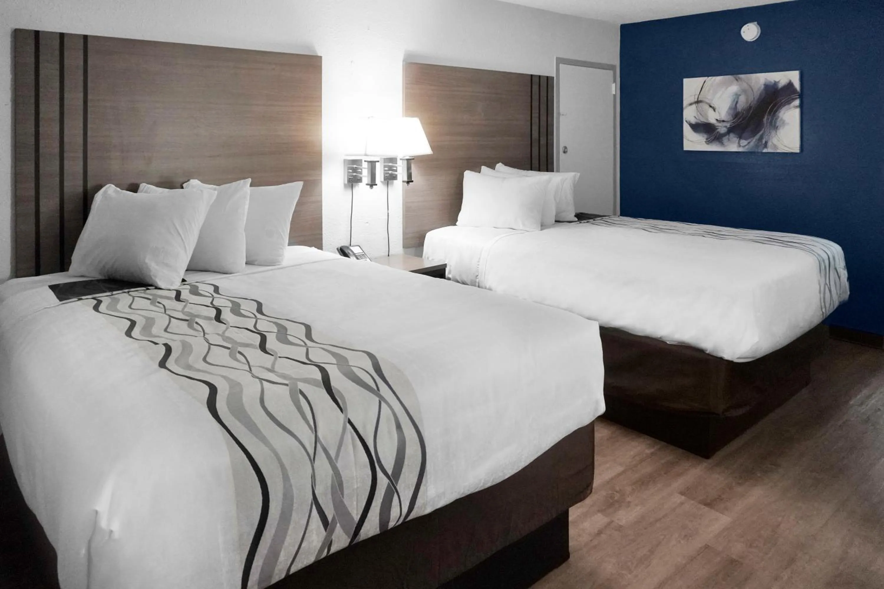 Bed in Hometown Inn + Kitchen