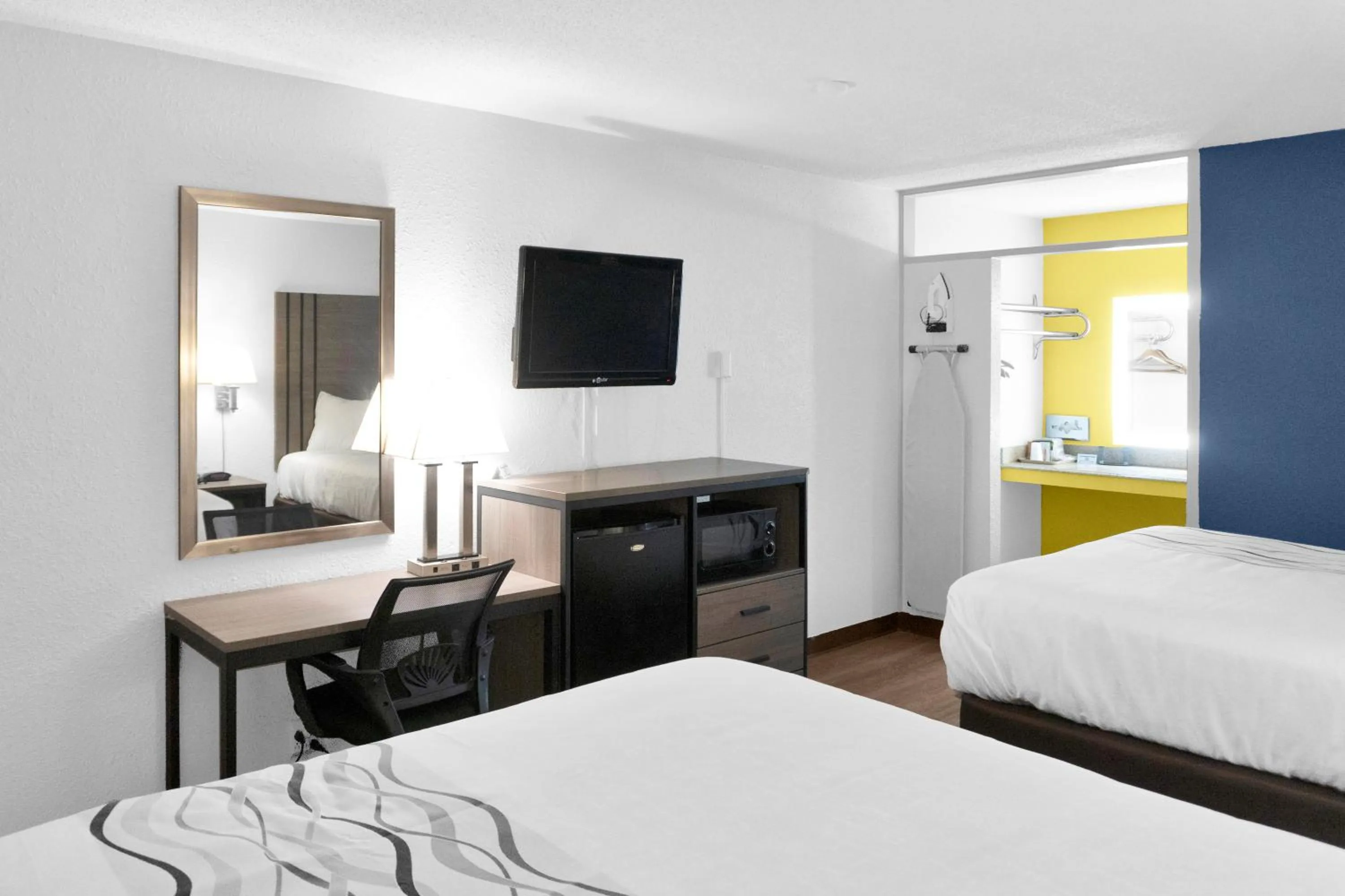 Bed in Hometown Inn + Kitchen