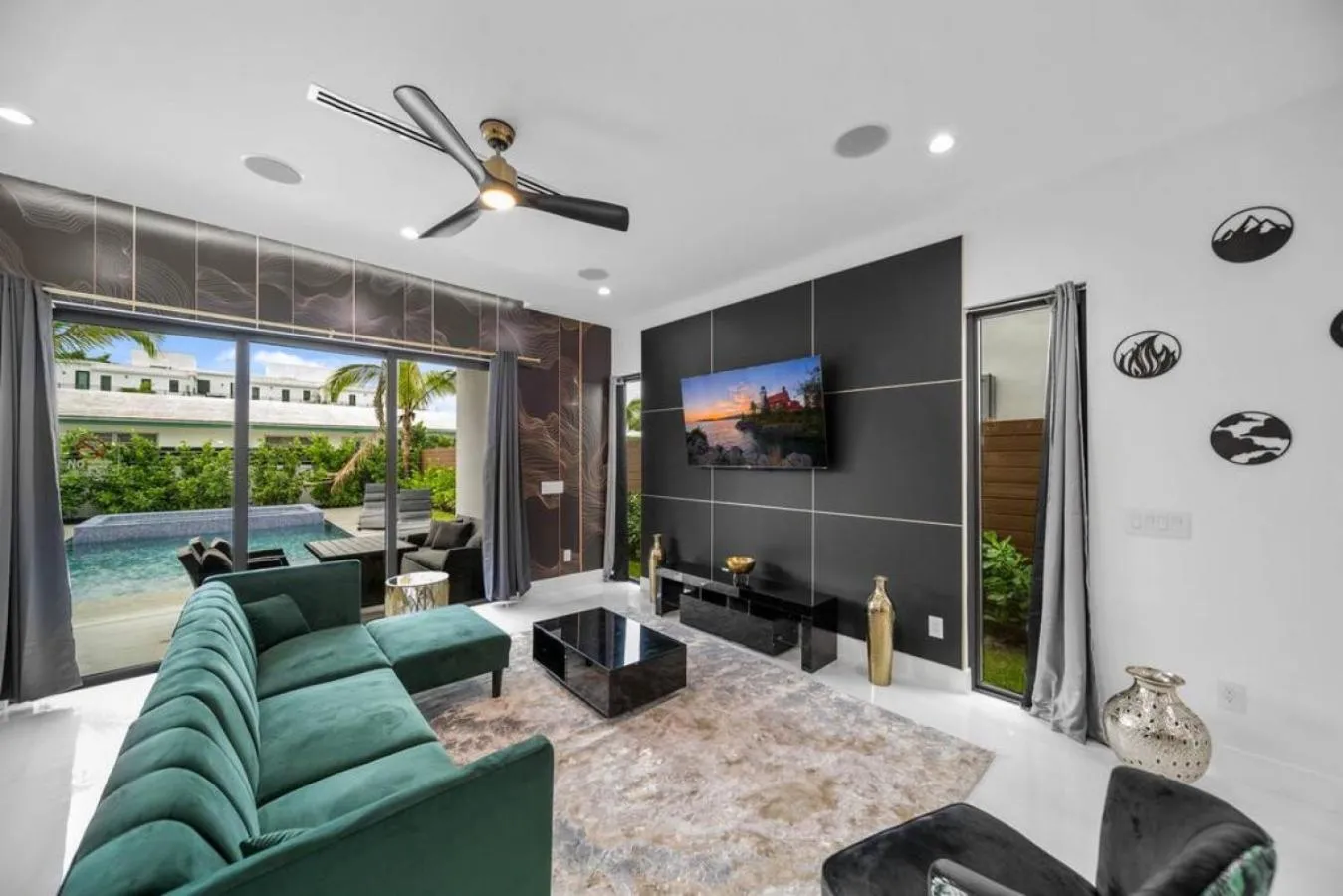 Living room in The Elements Home with 2 Pools
