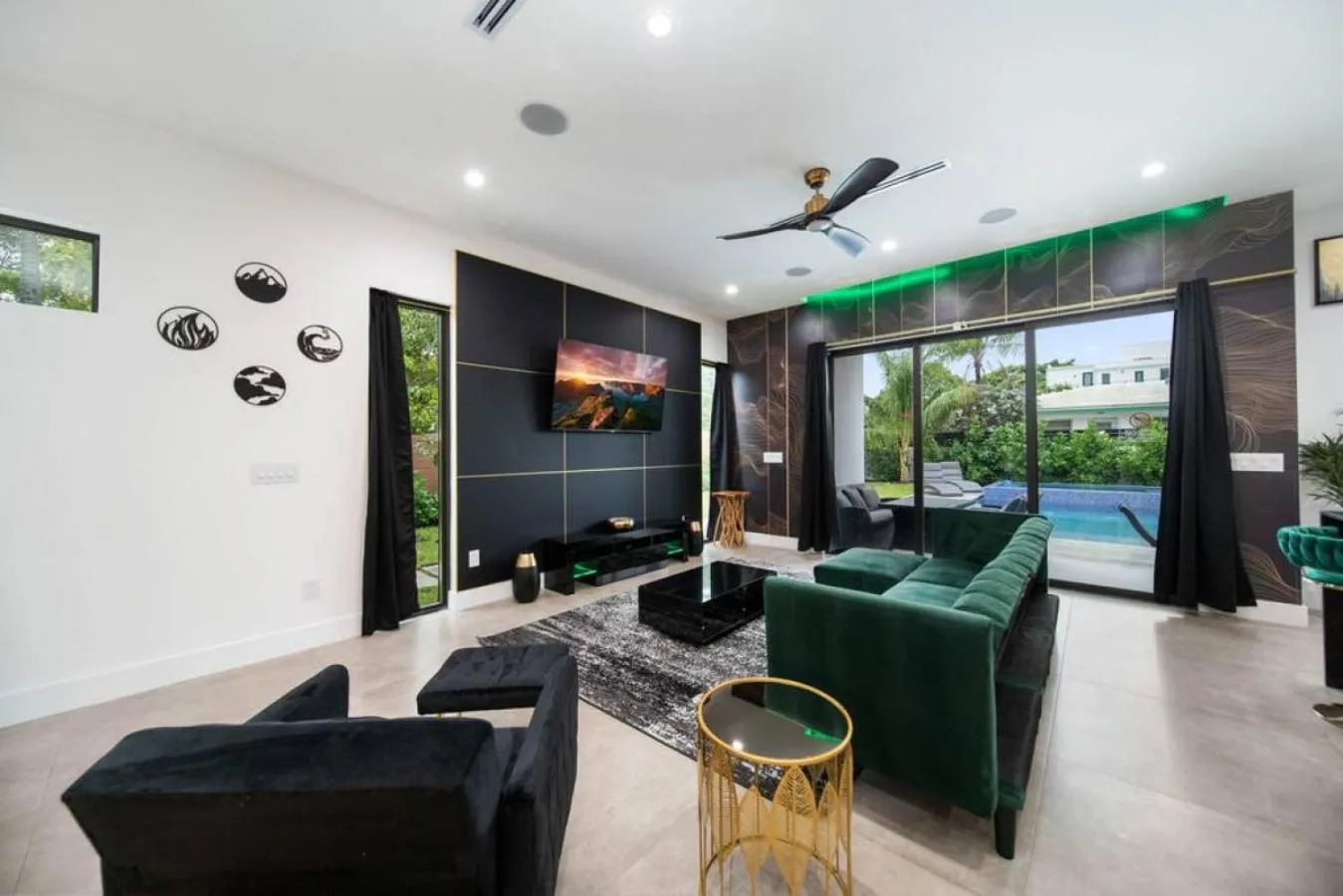 Living room in The Elements Home with 2 Pools