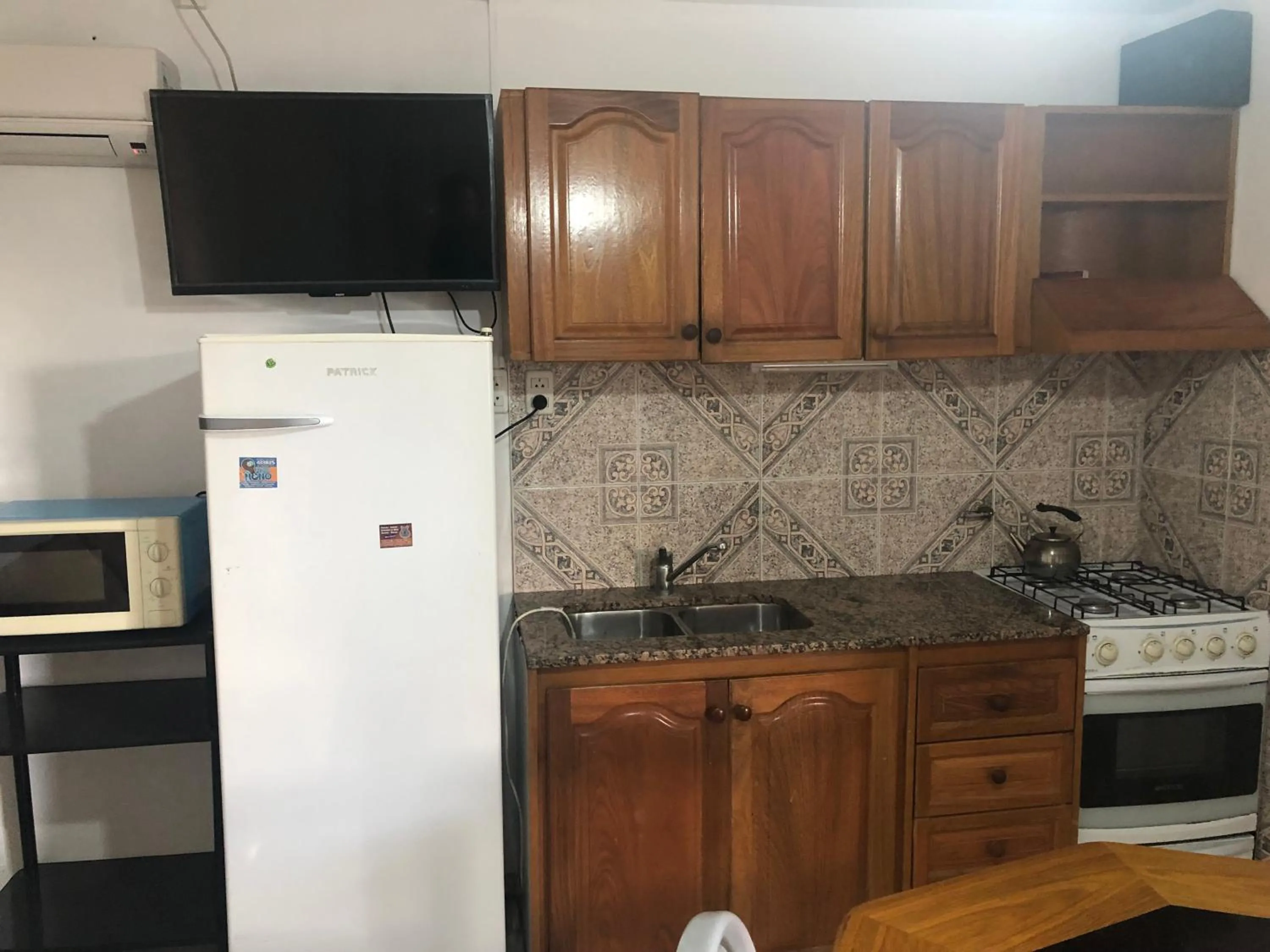 Kitchen or kitchenette in Apart-Hotel Gibert's House