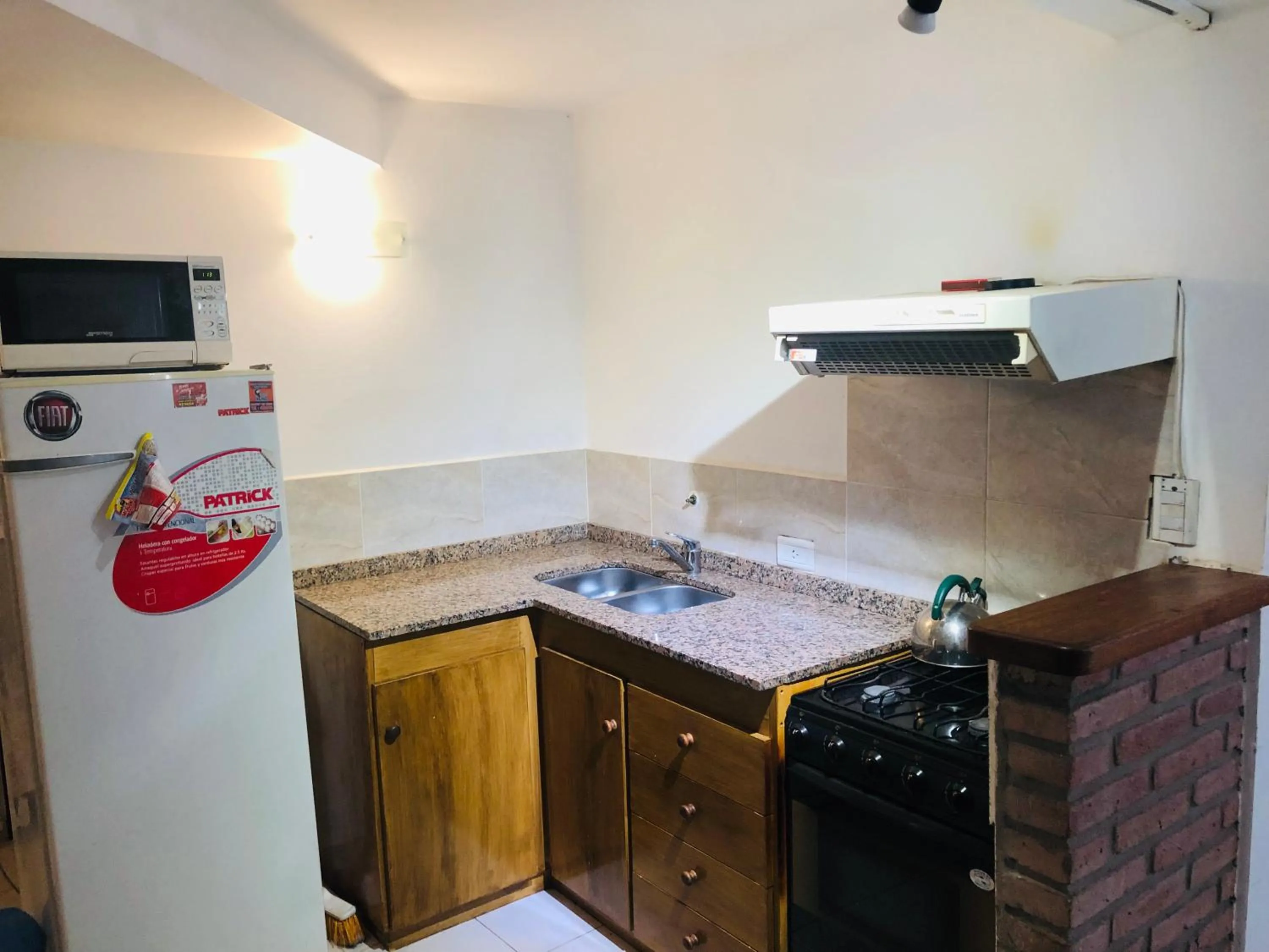 Kitchen or kitchenette in Apart-Hotel Gibert's House
