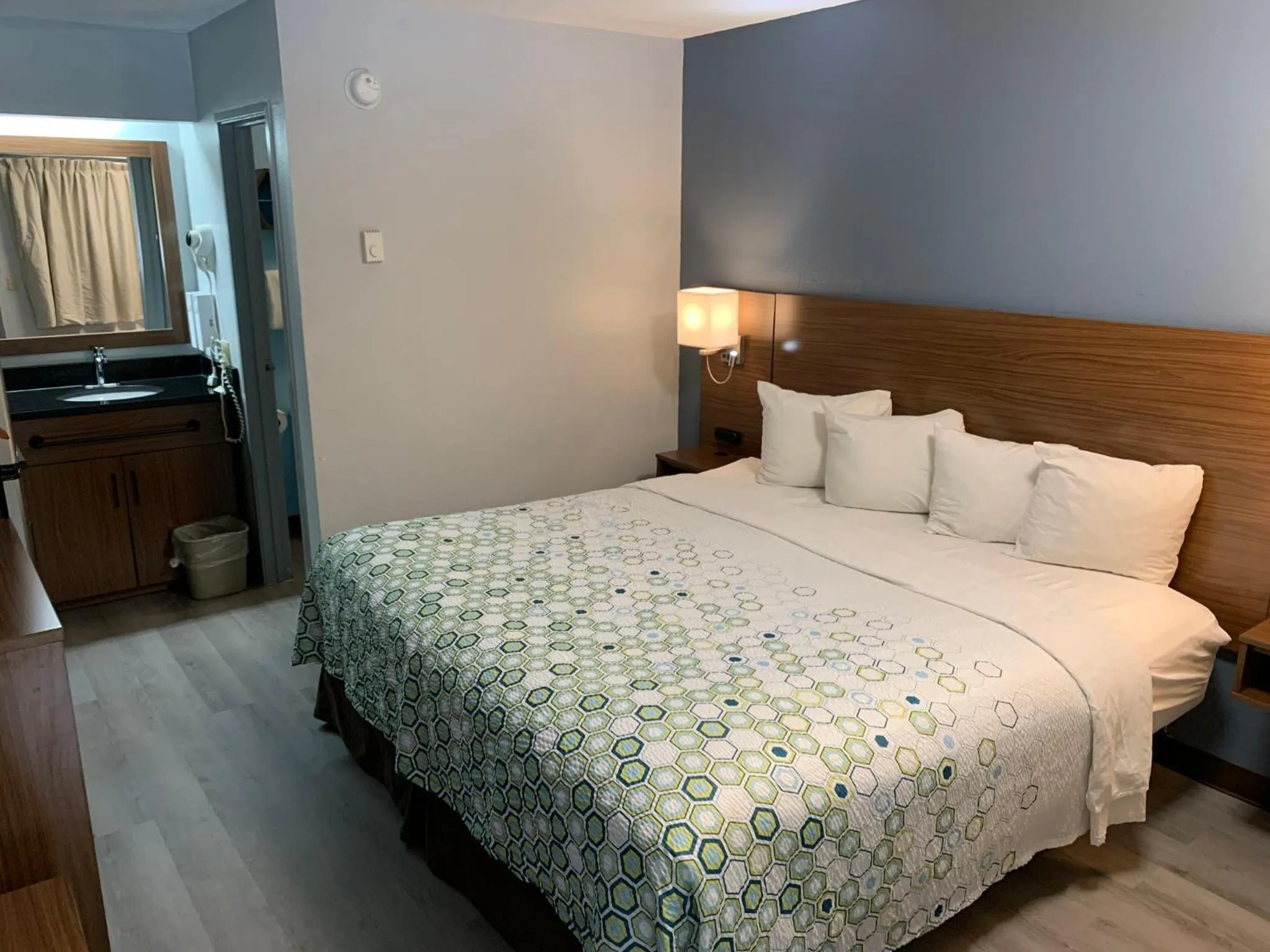 Bedroom, Bed in HomeTowne Studios by Red Roof Mystic - New London