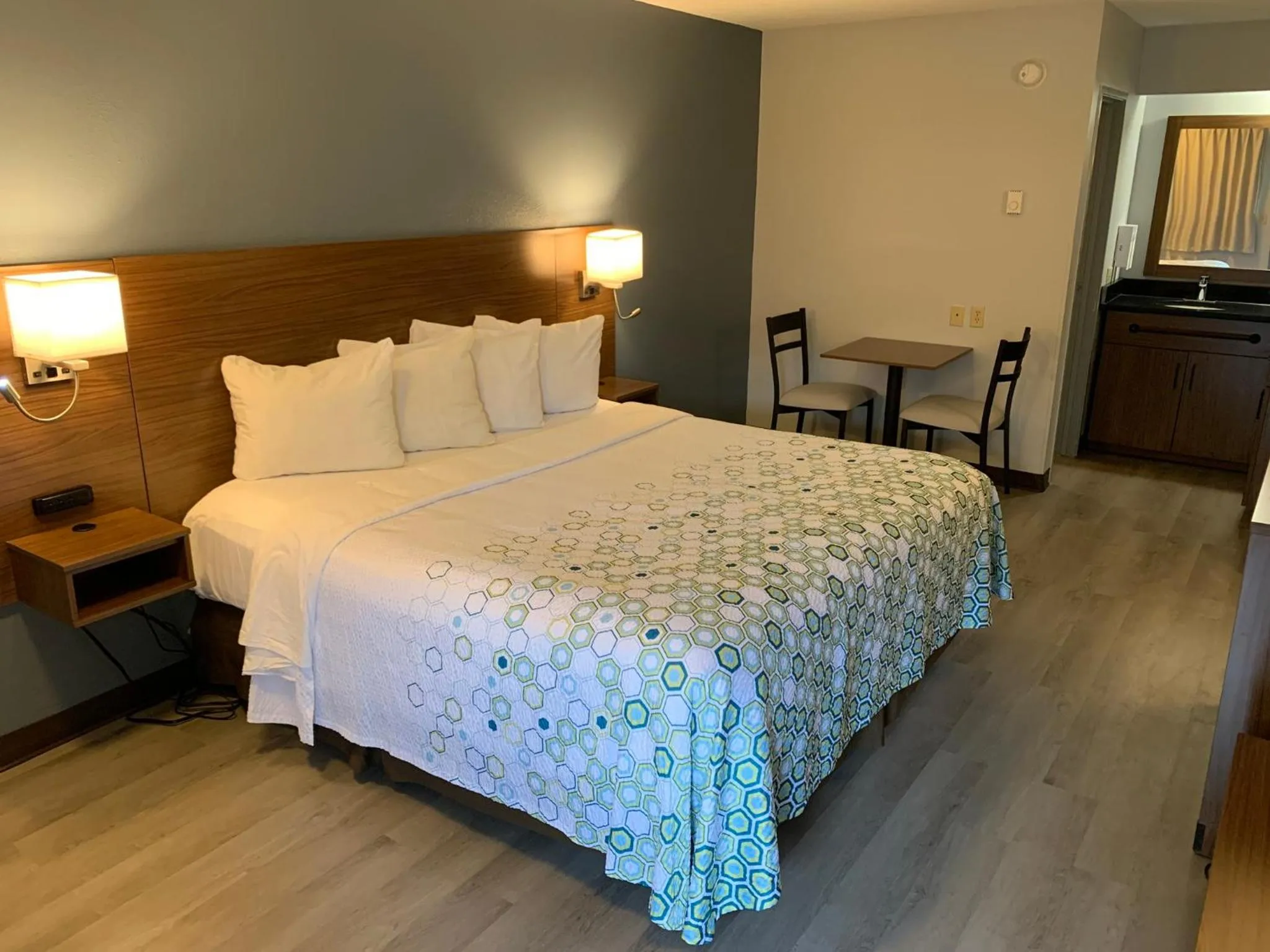 Bedroom, Bed in HomeTowne Studios by Red Roof Mystic - New London