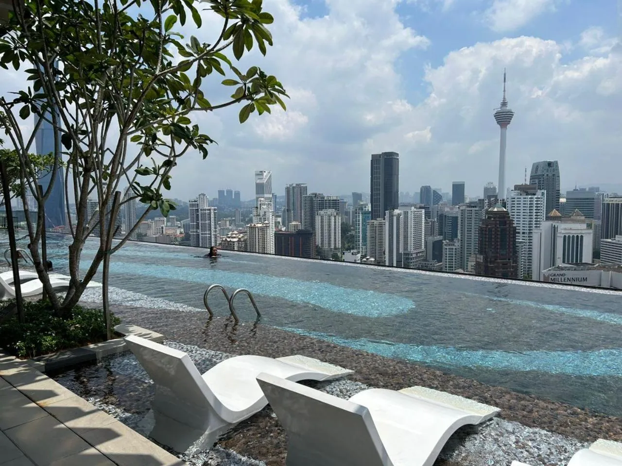 Pool view in Axon Residence at Pavilion KLCC KL Tower view by KIMIRO