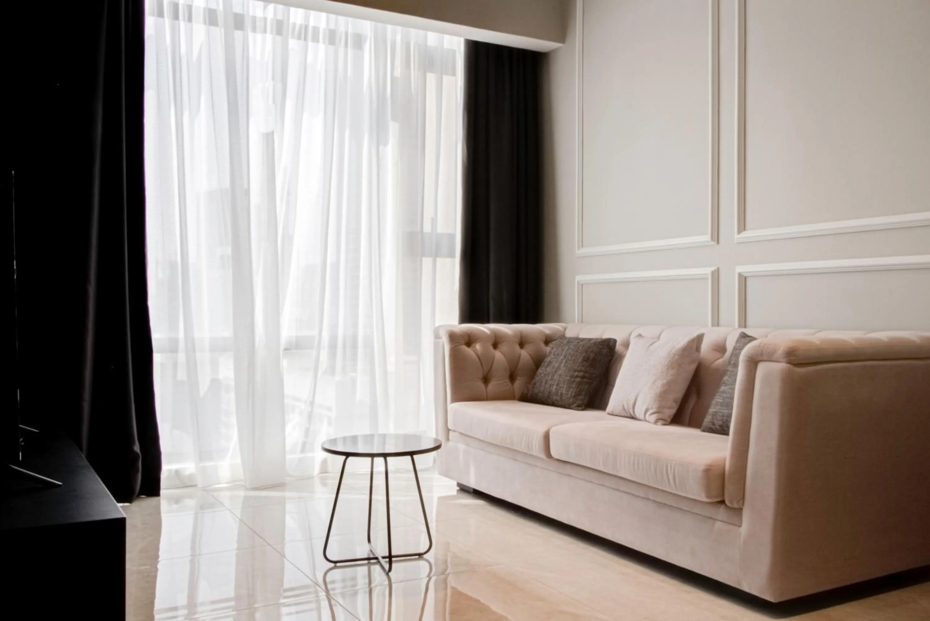 Living room in Axon Residence at Pavilion KLCC KL Tower view by KIMIRO