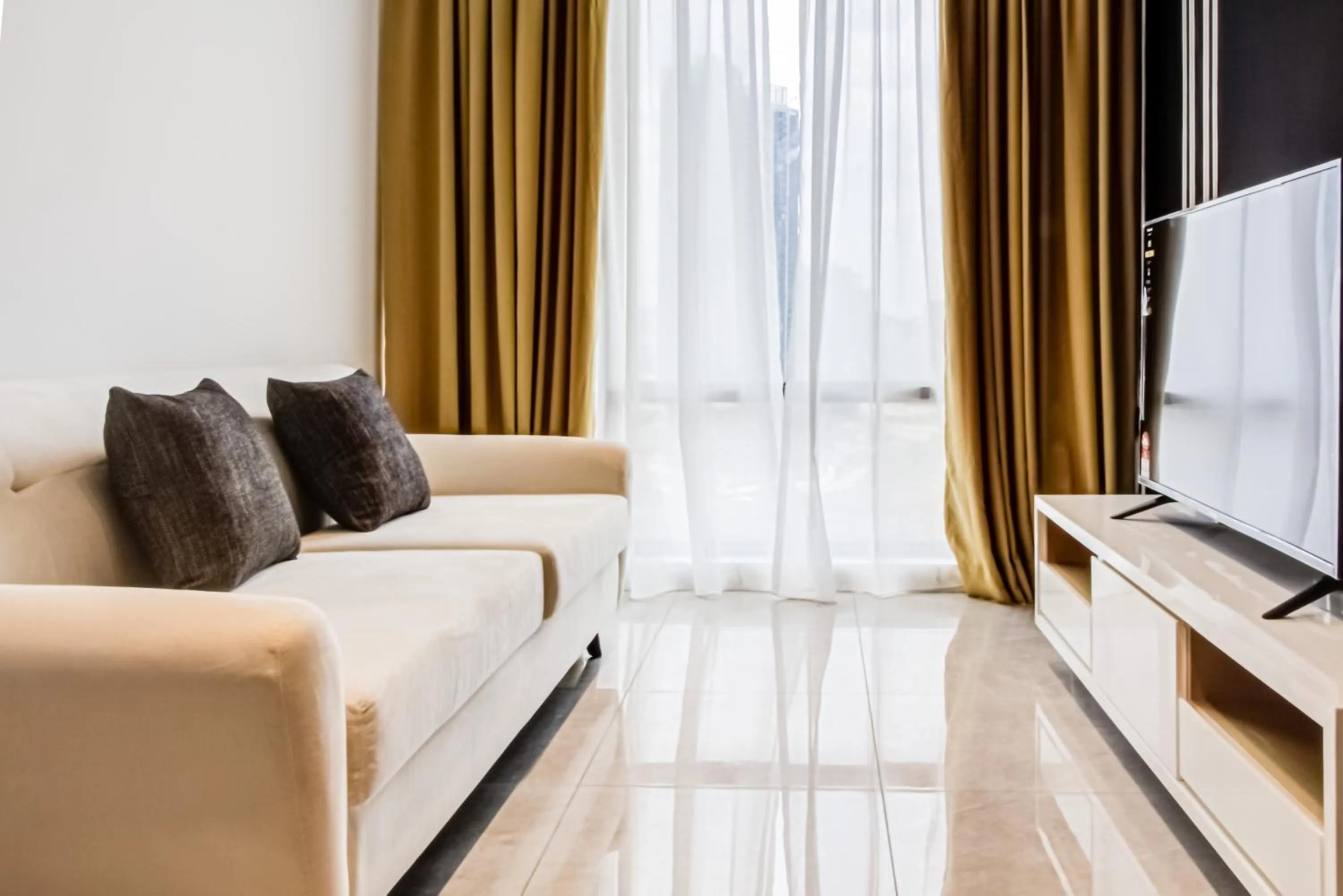 Seating area in Axon Residence at Pavilion KLCC KL Tower view by KIMIRO