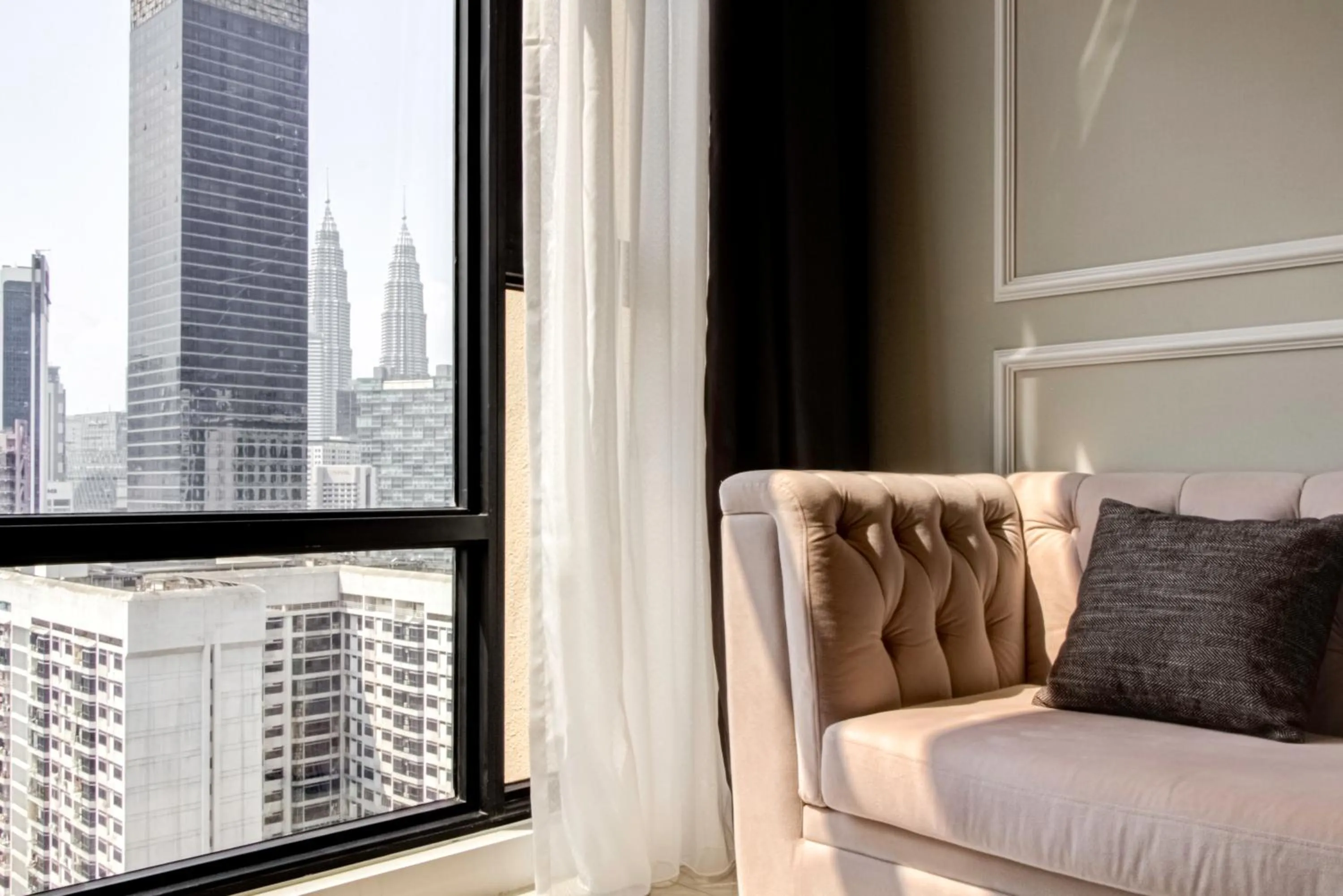 Living room in Axon Residence at Pavilion KLCC KL Tower view by KIMIRO