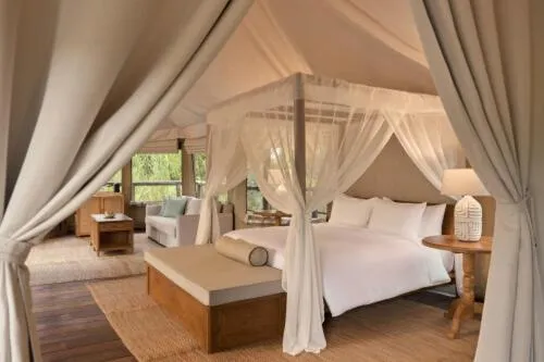 Bed in Tantawan Tented Camp by Dusit, Chiang Rai