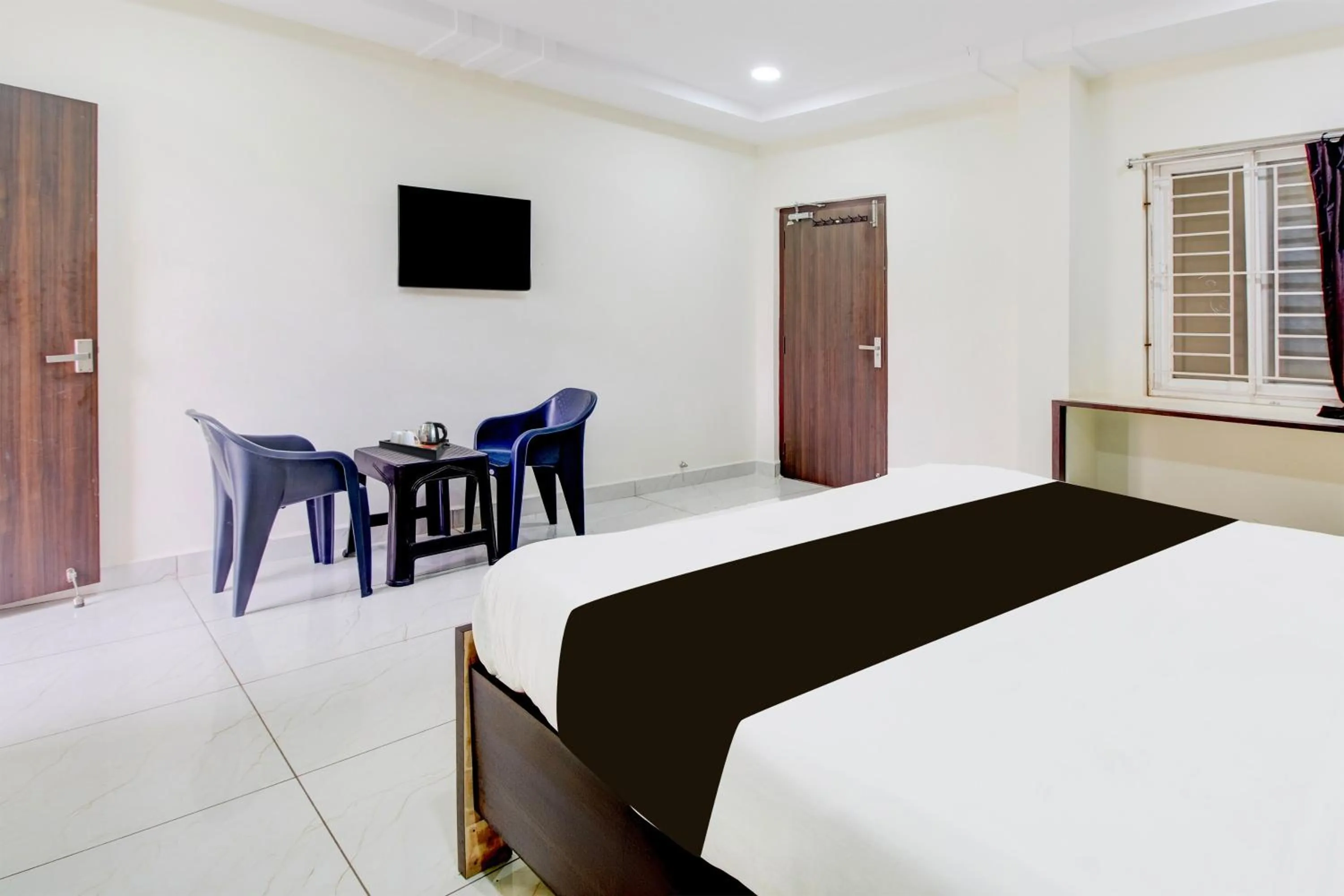 Bedroom, Bed in Super Hotel O Ramavarapadu Near PVR Icon