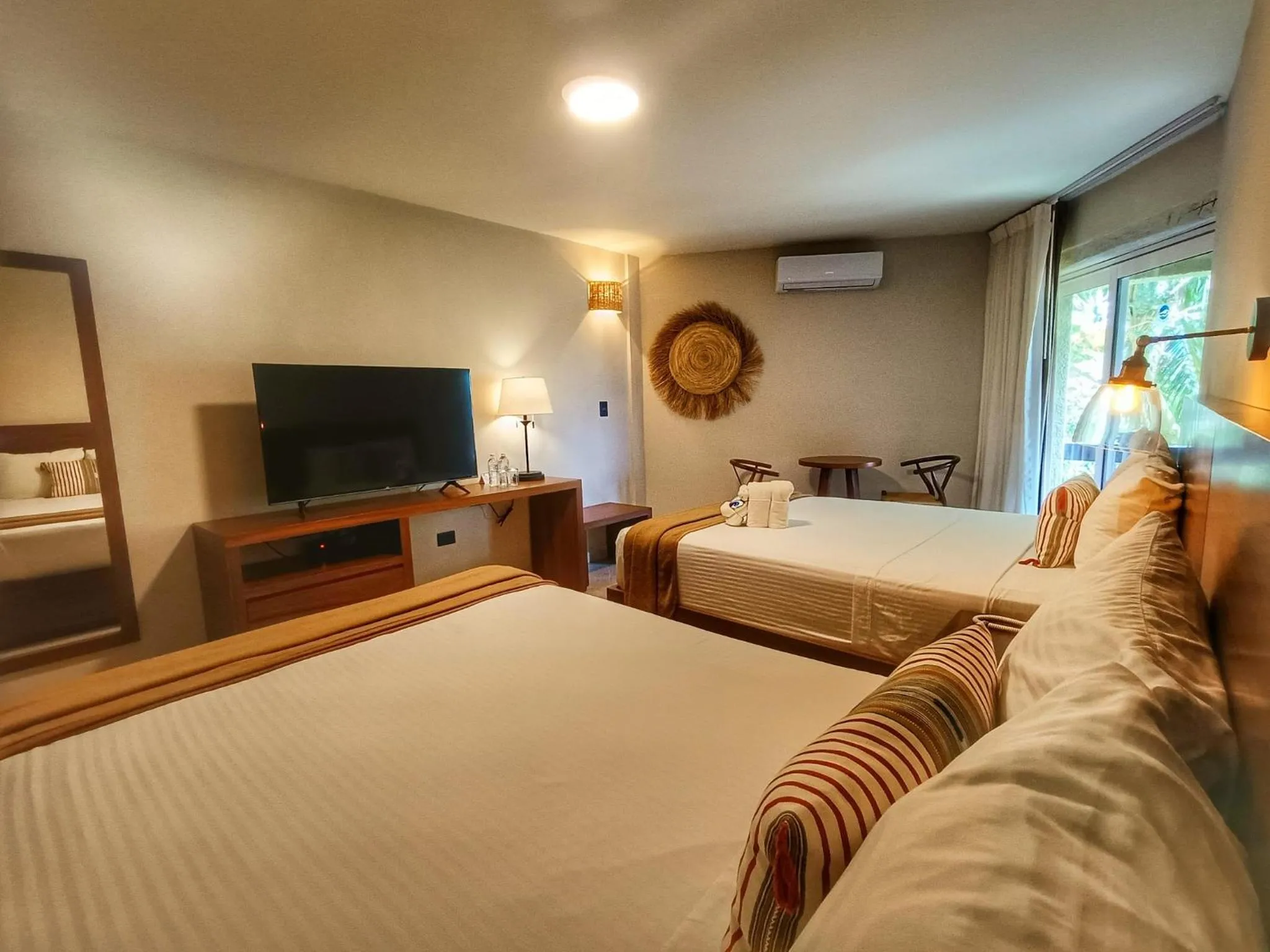 Bed in Casa del Mar Cozumel Hotel & Dive Resort with free access to an exclusive beach club