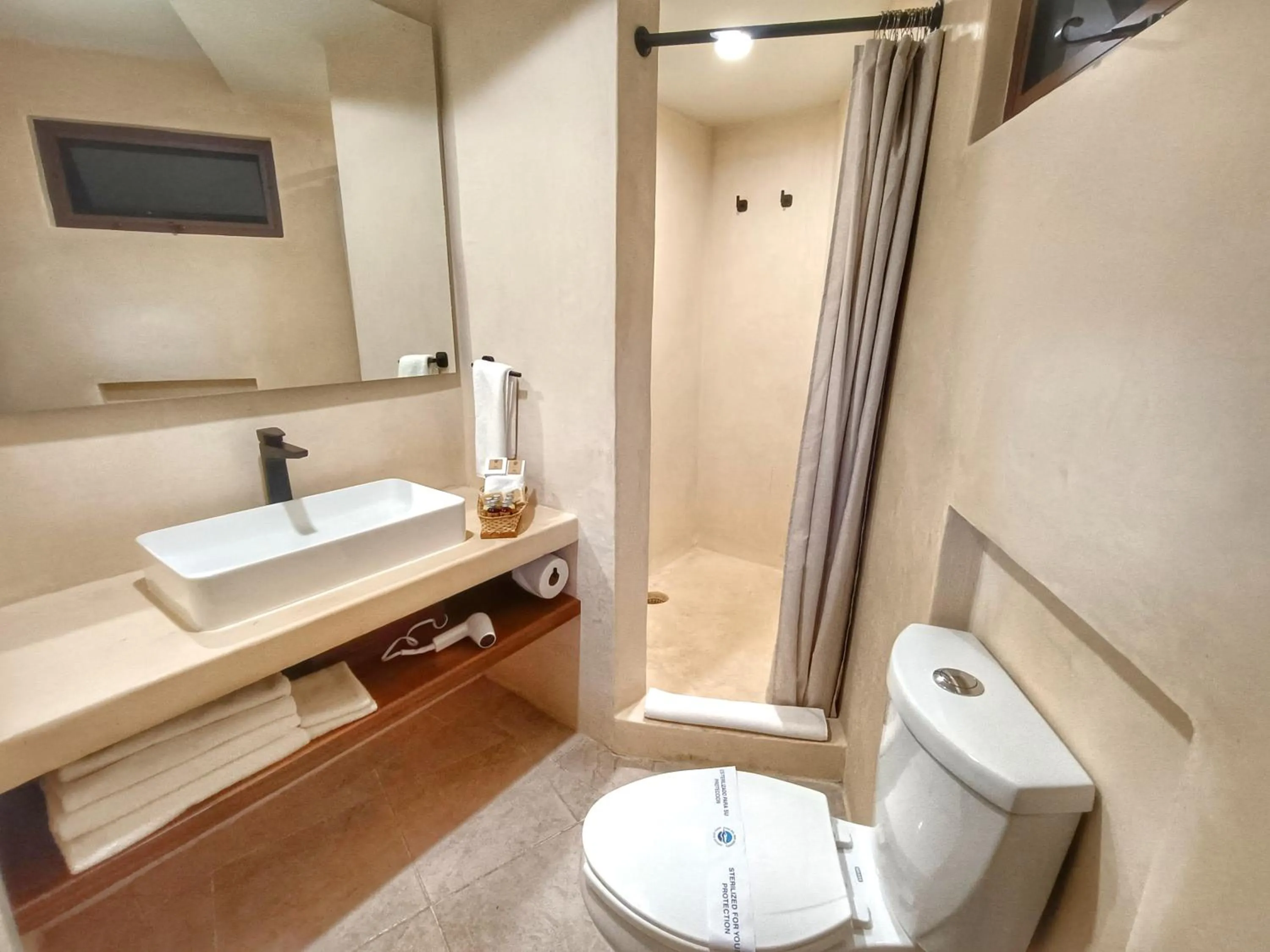 Bathroom in Casa del Mar Cozumel Hotel & Dive Resort with free access to an exclusive beach club