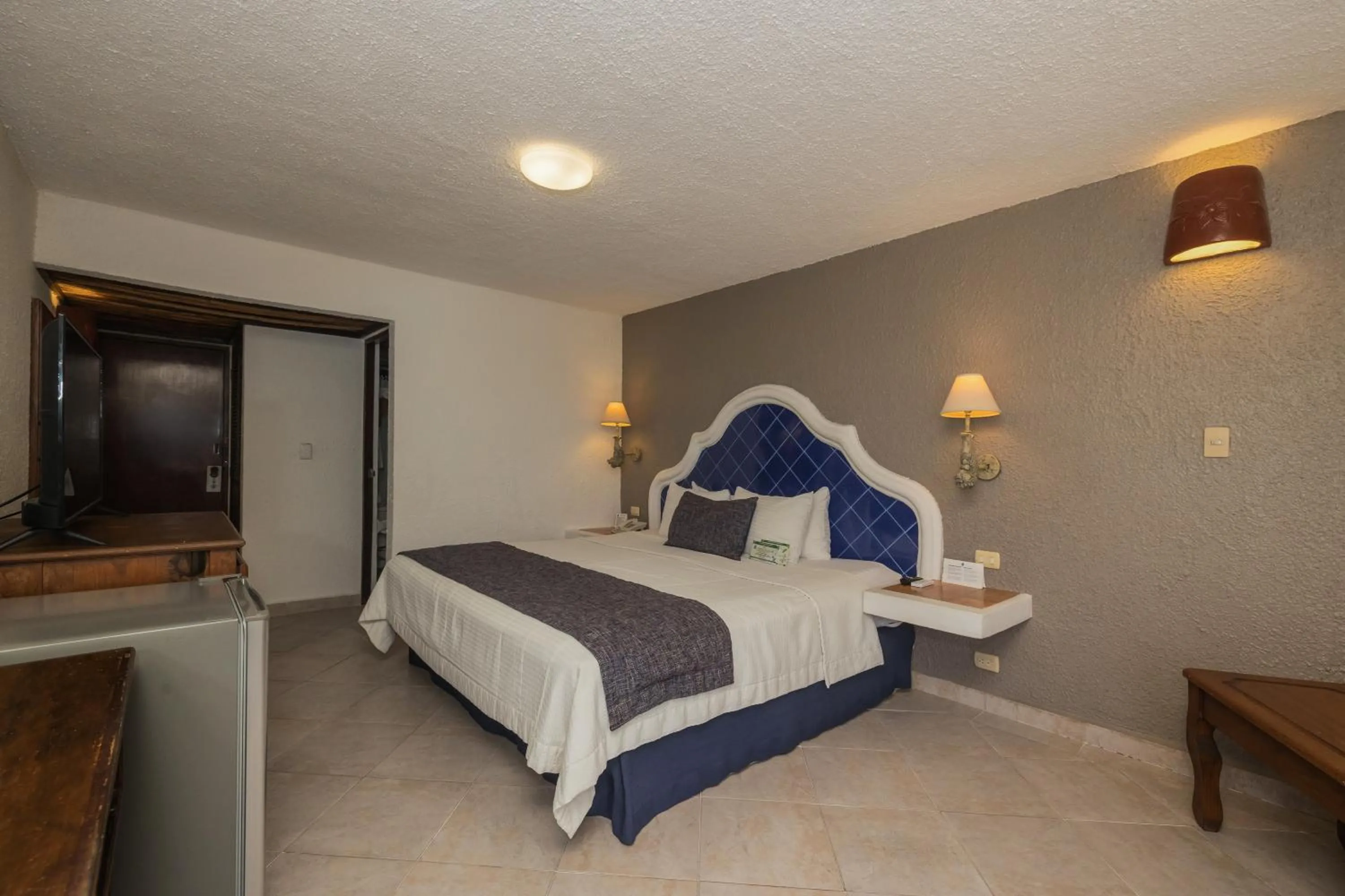 Bed in Casa del Mar Cozumel Hotel & Dive Resort with free access to an exclusive beach club