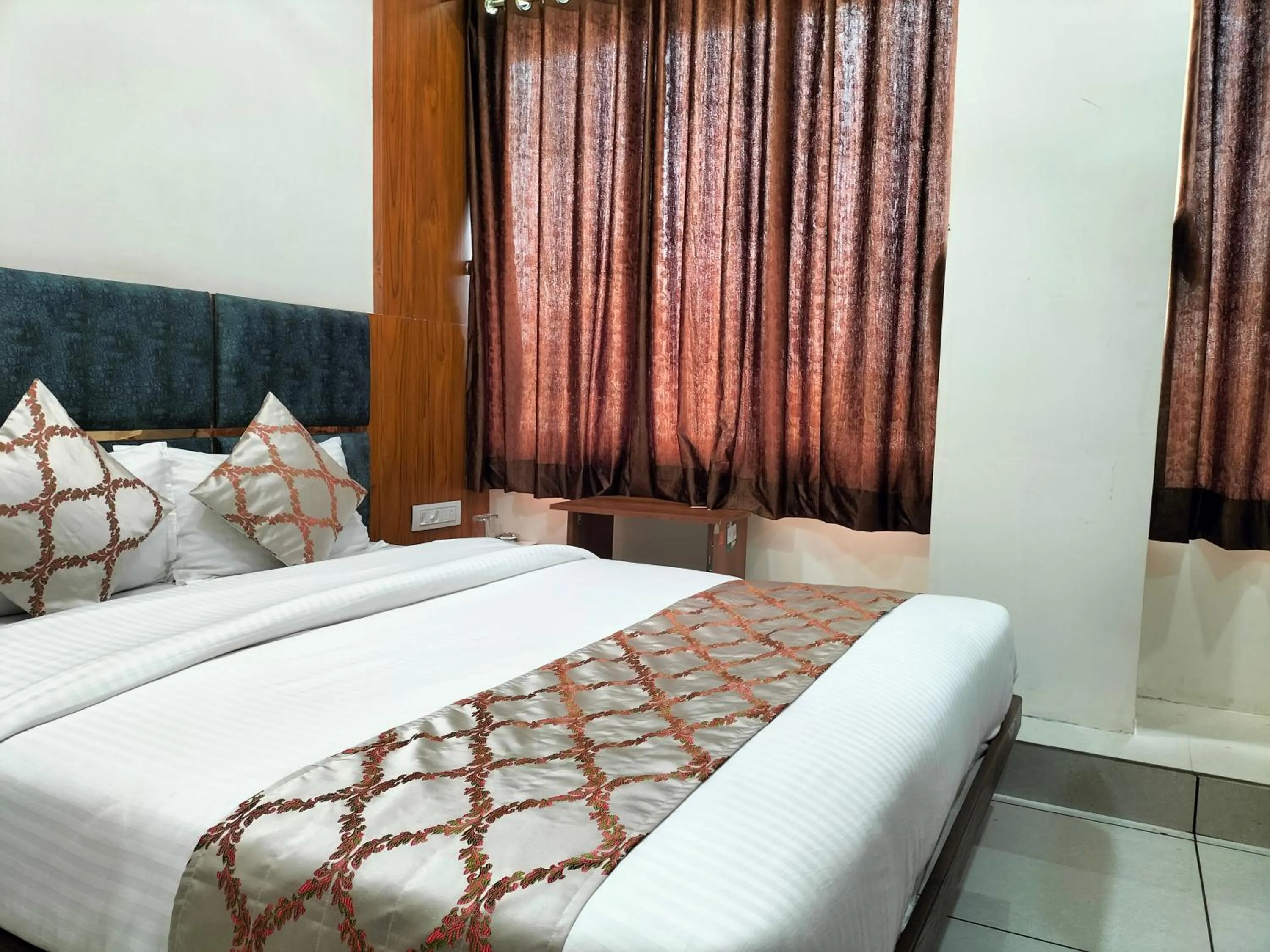 Bed in Hotel Divya Palace