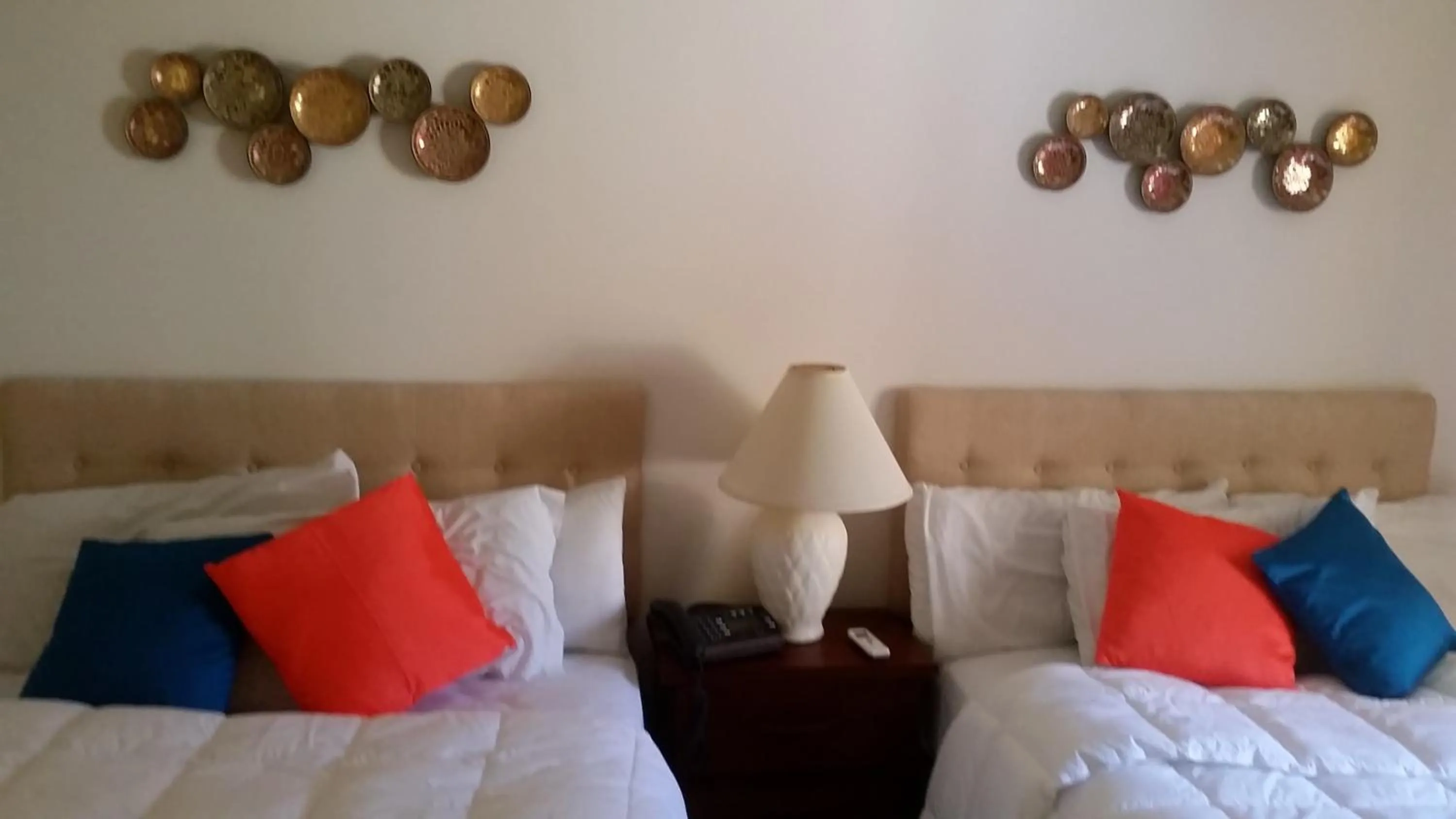 Bed in Sunset Shores Beach Hotel