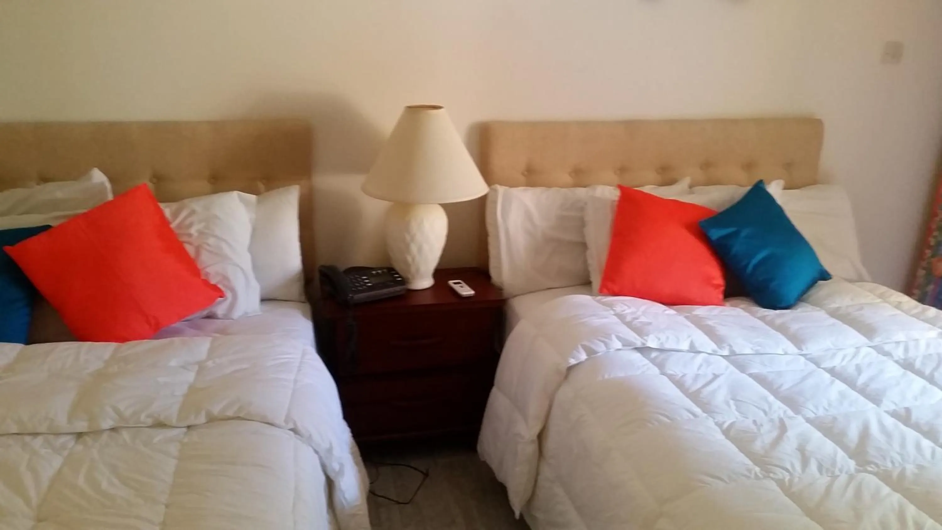 Bed in Sunset Shores Beach Hotel