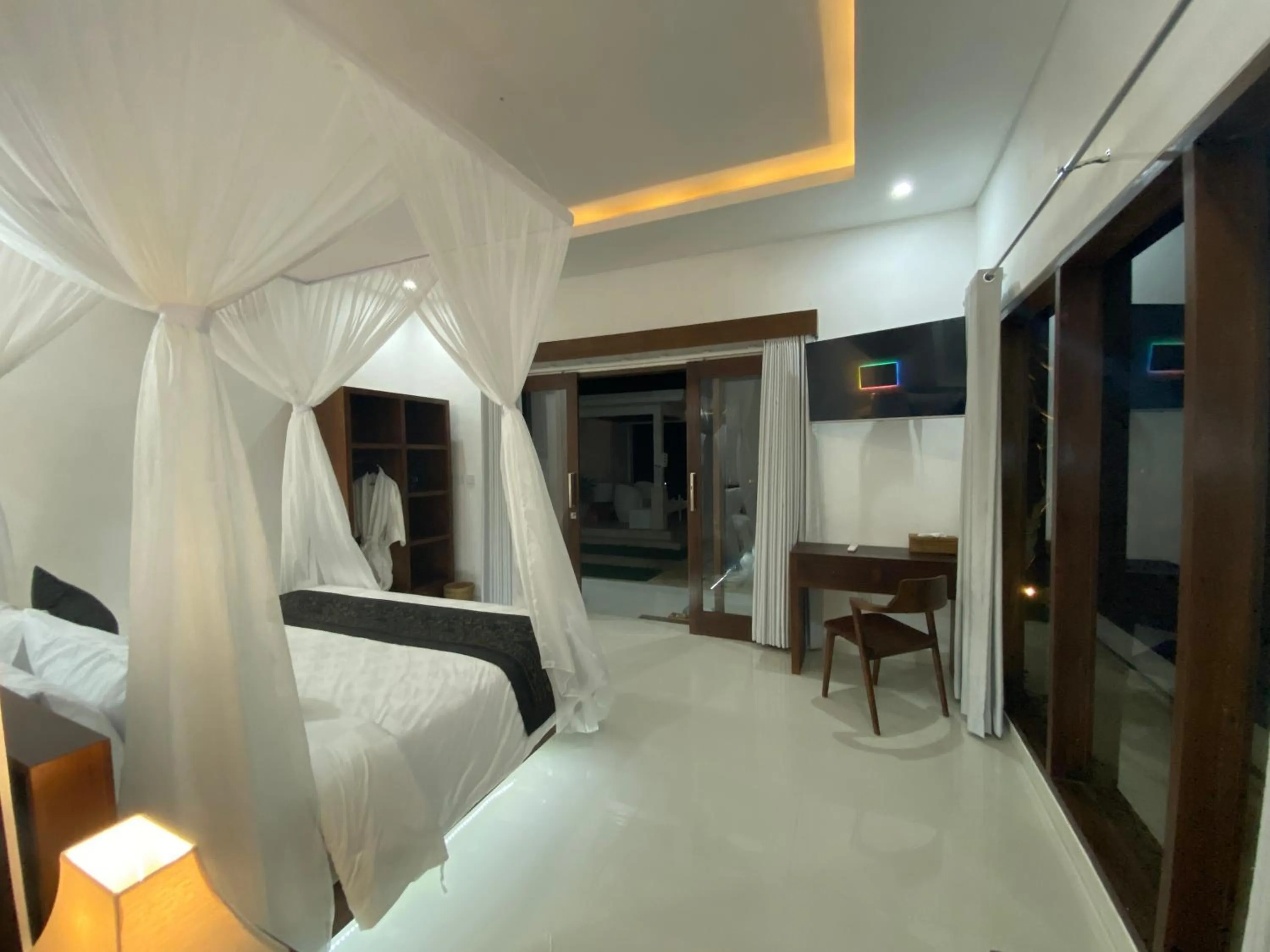 Communal lounge/ TV room, Bed in Namika Villas Ubud