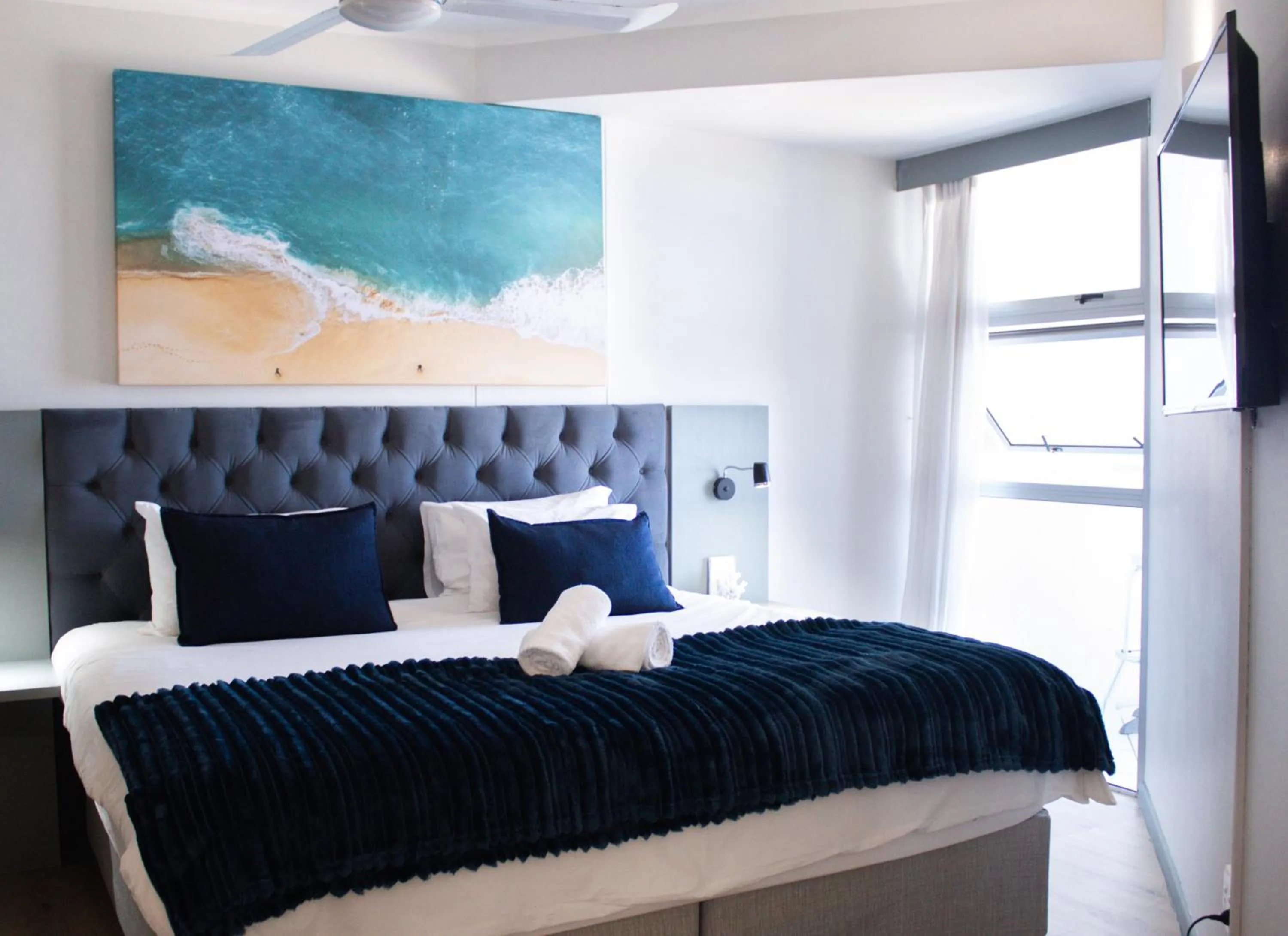 Bed in Ocean Breeze Hotel