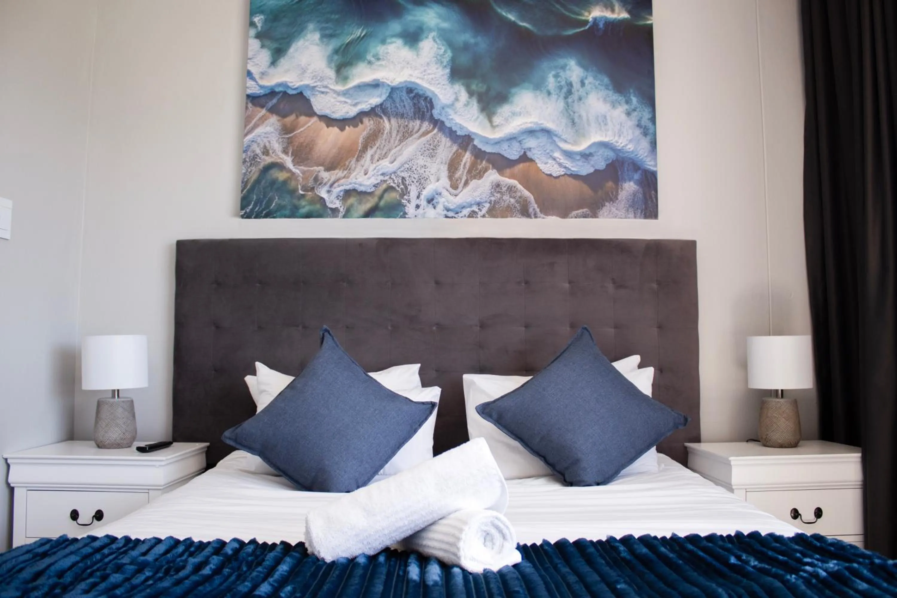 Bed in Ocean Breeze Hotel