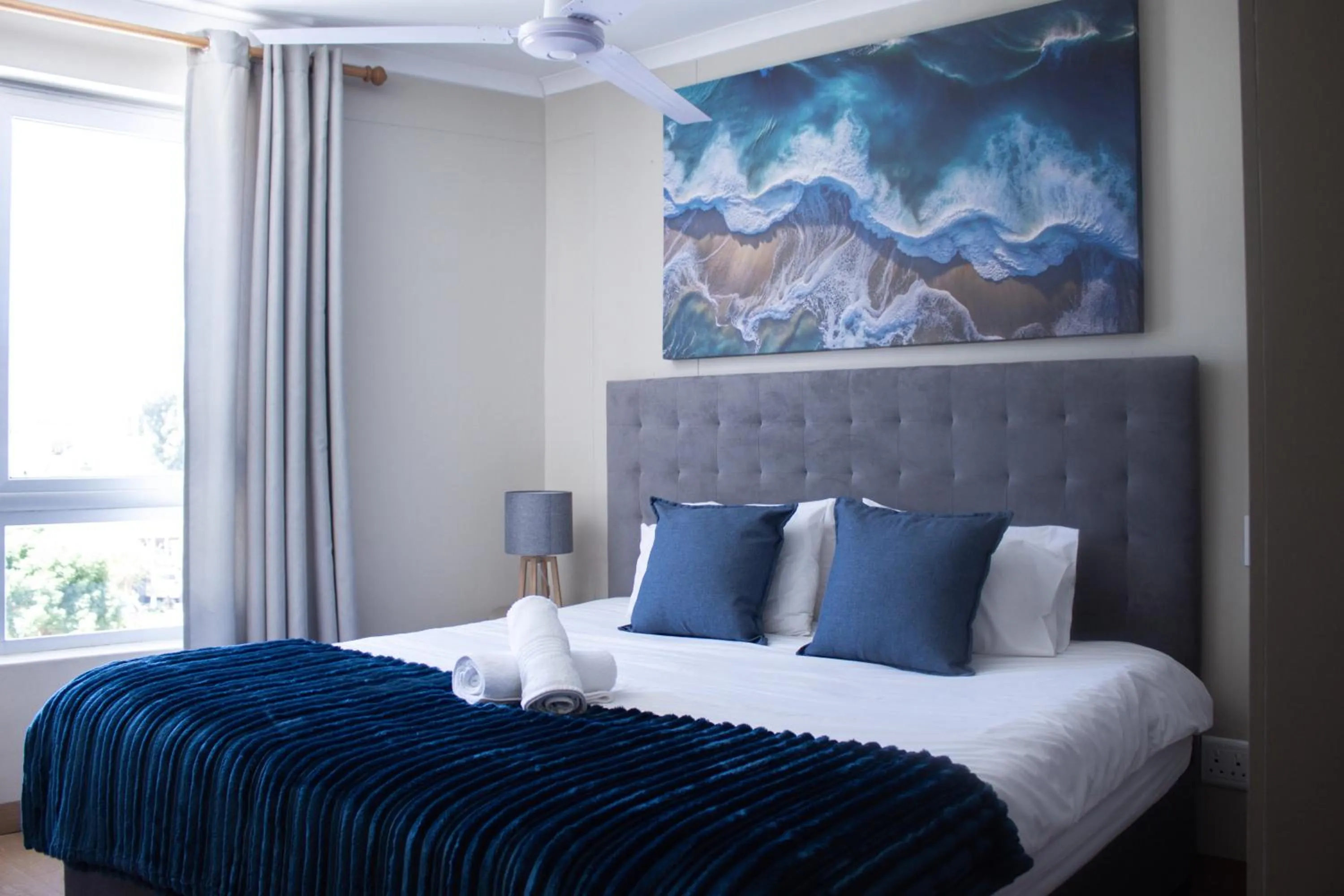 Bed in Ocean Breeze Hotel