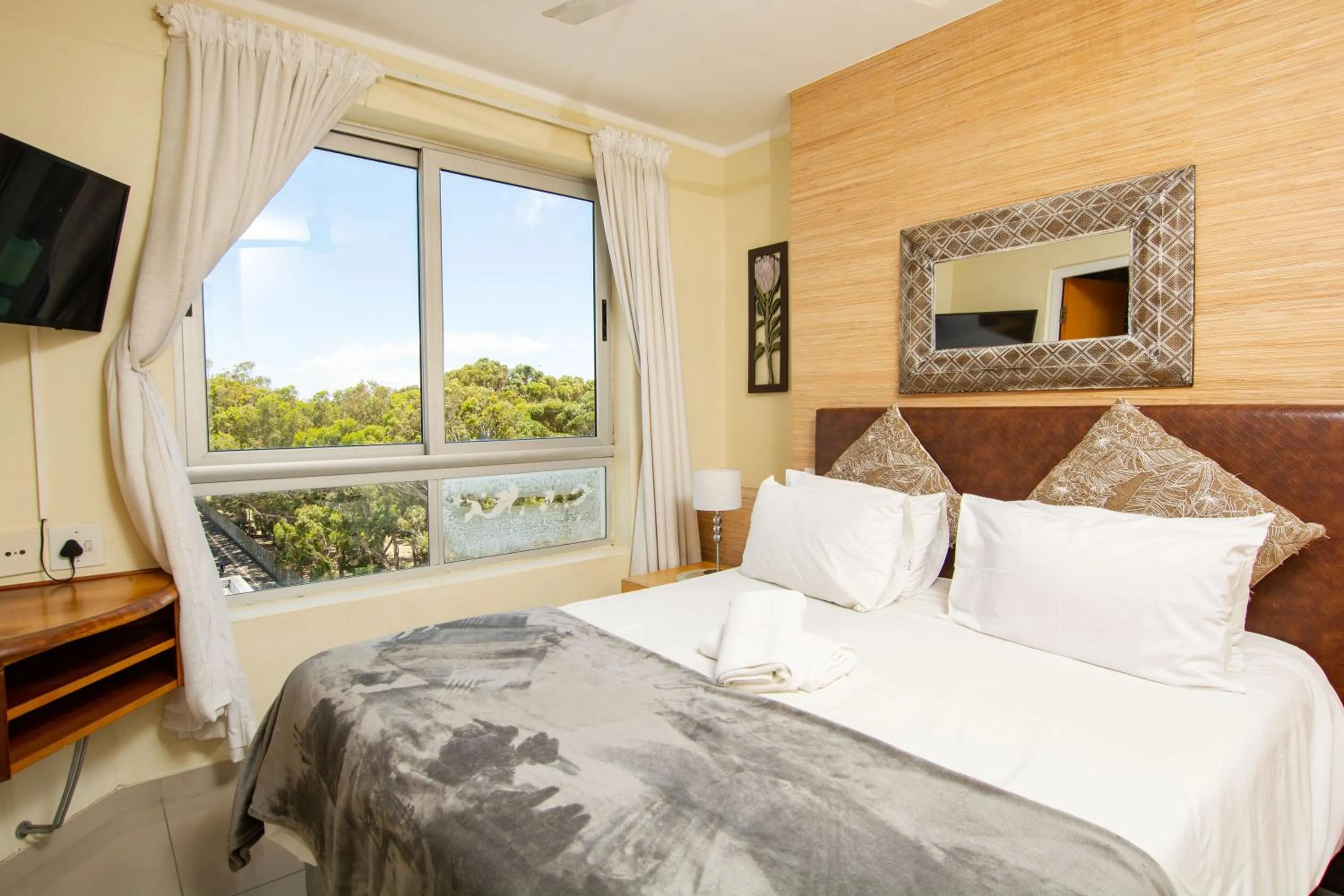 Bed in Ocean Breeze Hotel