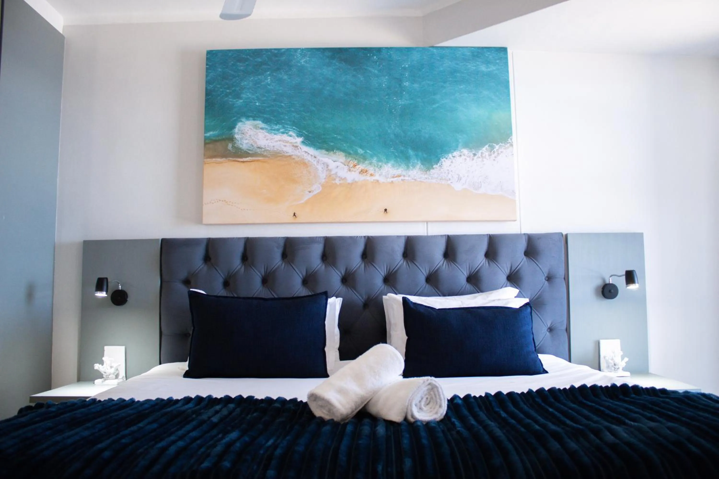 Bed in Ocean Breeze Hotel