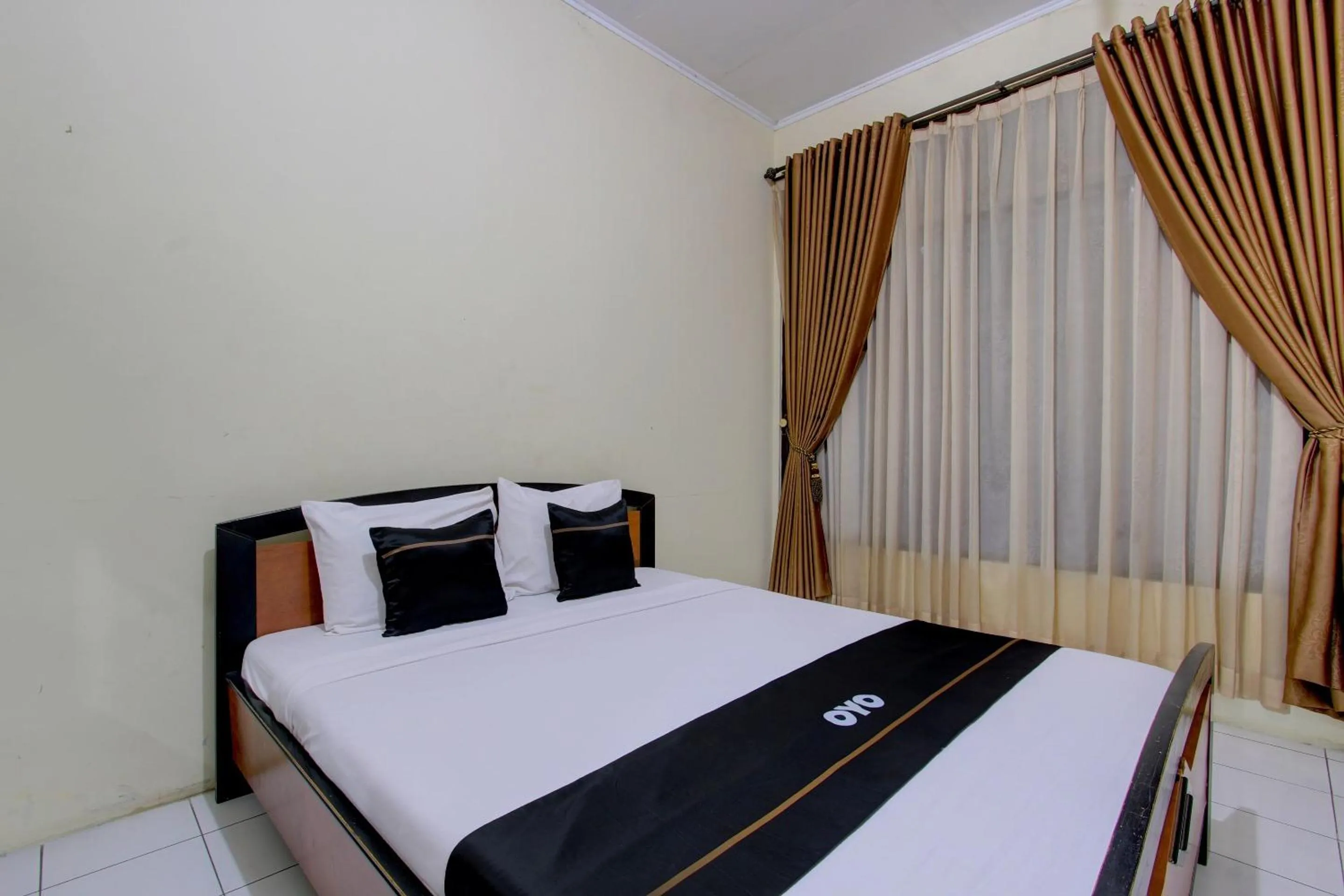 Bedroom in Capital O 93024 Hotel Ganesha